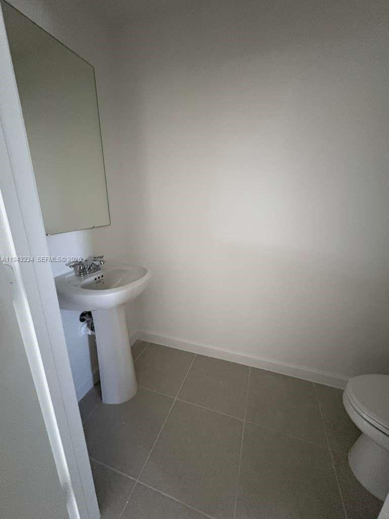 35663 Southwest 178th Court Homestead, FL 33034 - Photo 6 of 23 a white bathroom with sink and toilet