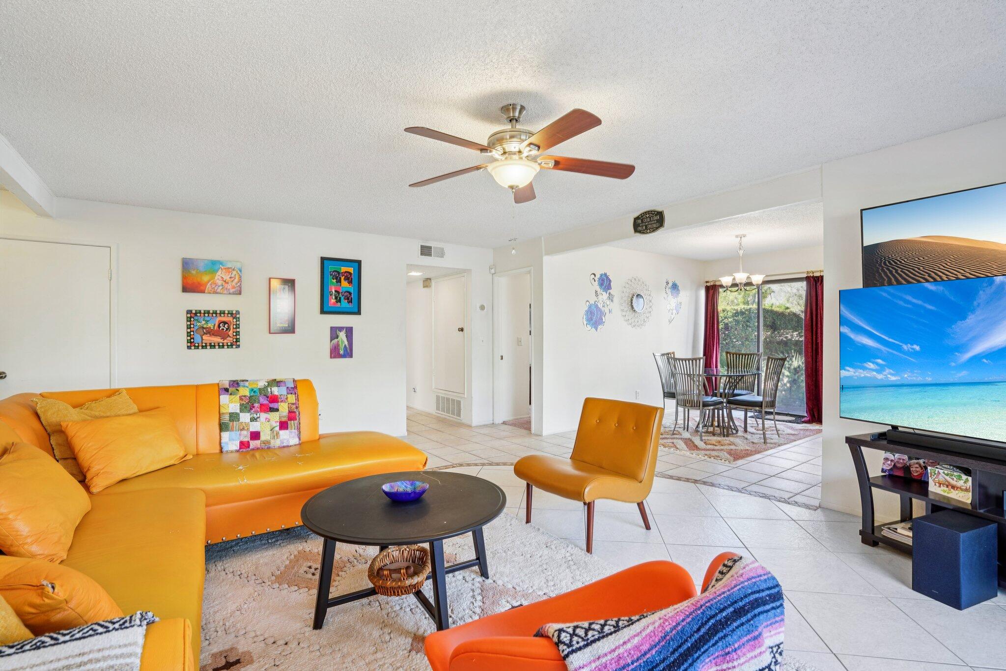a living room with furniture and a rug