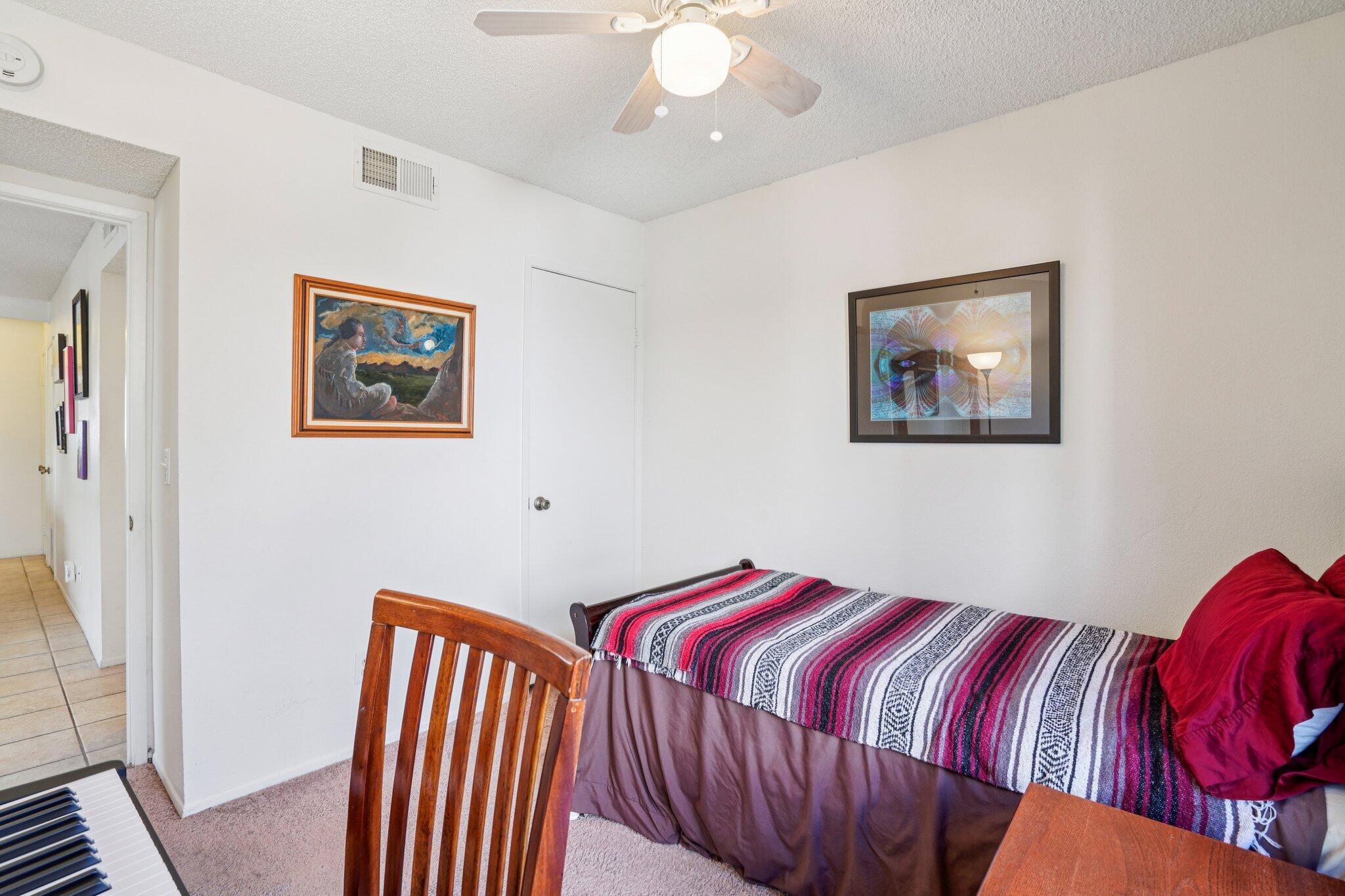 3155 Ramon Road, Unit 311 Palm Springs, CA 92264 - Photo 18 of 29 a bedroom with a bed and a painting on the wall