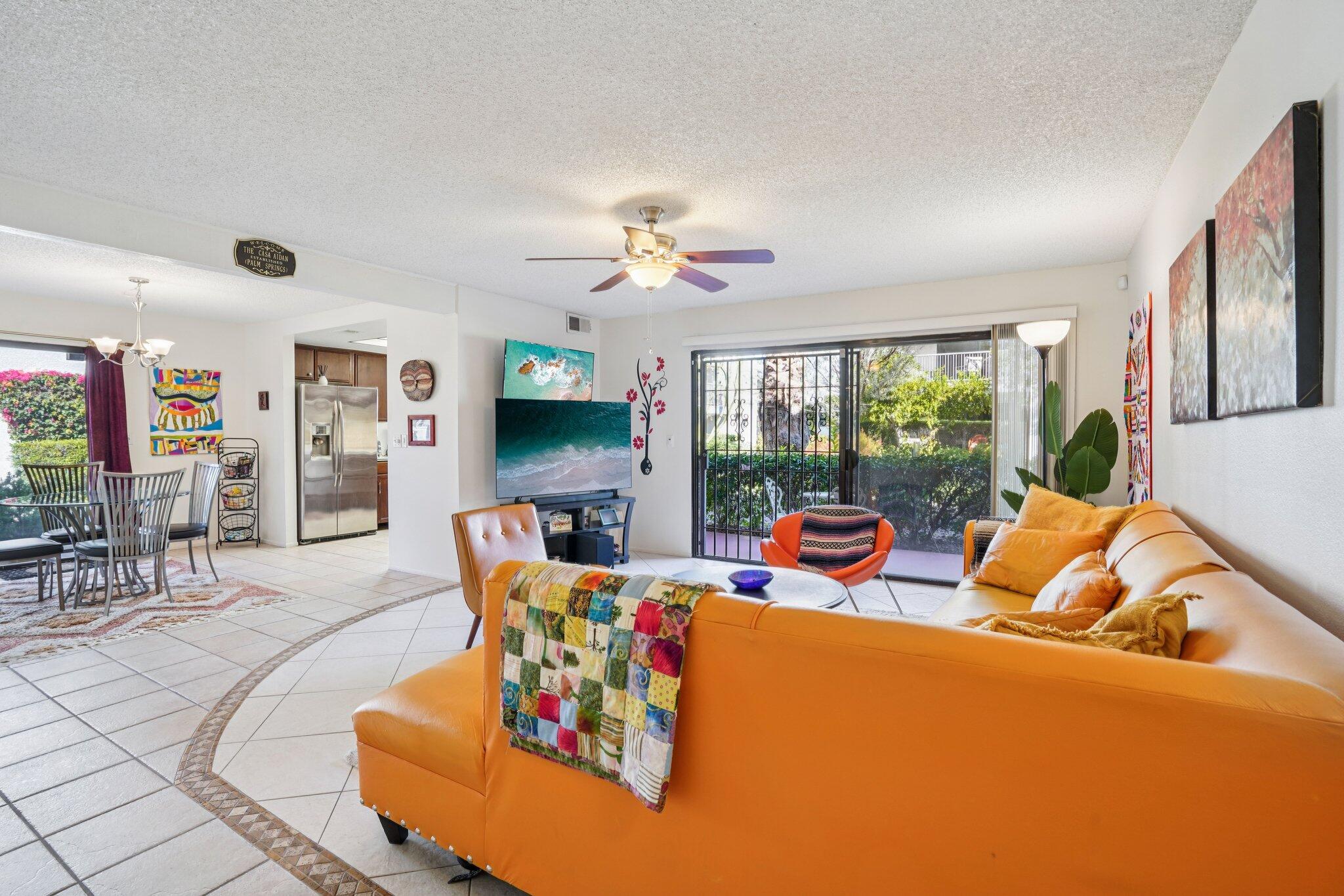 3155 Ramon Road, Unit 311 Palm Springs, CA 92264 - Photo 3 of 29 a living room with furniture and a large window