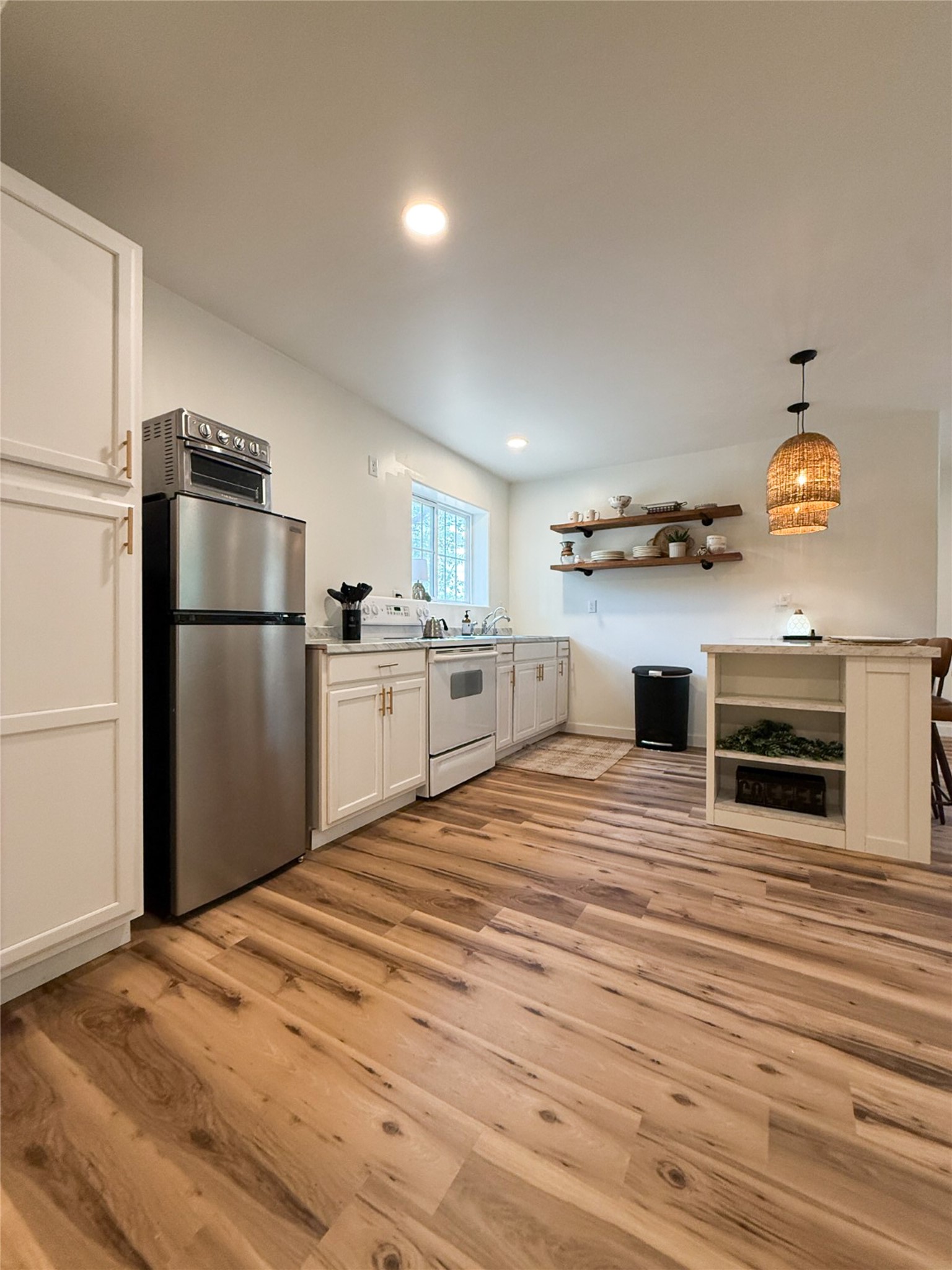 740 Bridget Avenue Buffalo, TX 75831 - Photo 42 of 50 a kitchen with stainless steel appliances granite countertop a refrigerator and a stove top oven