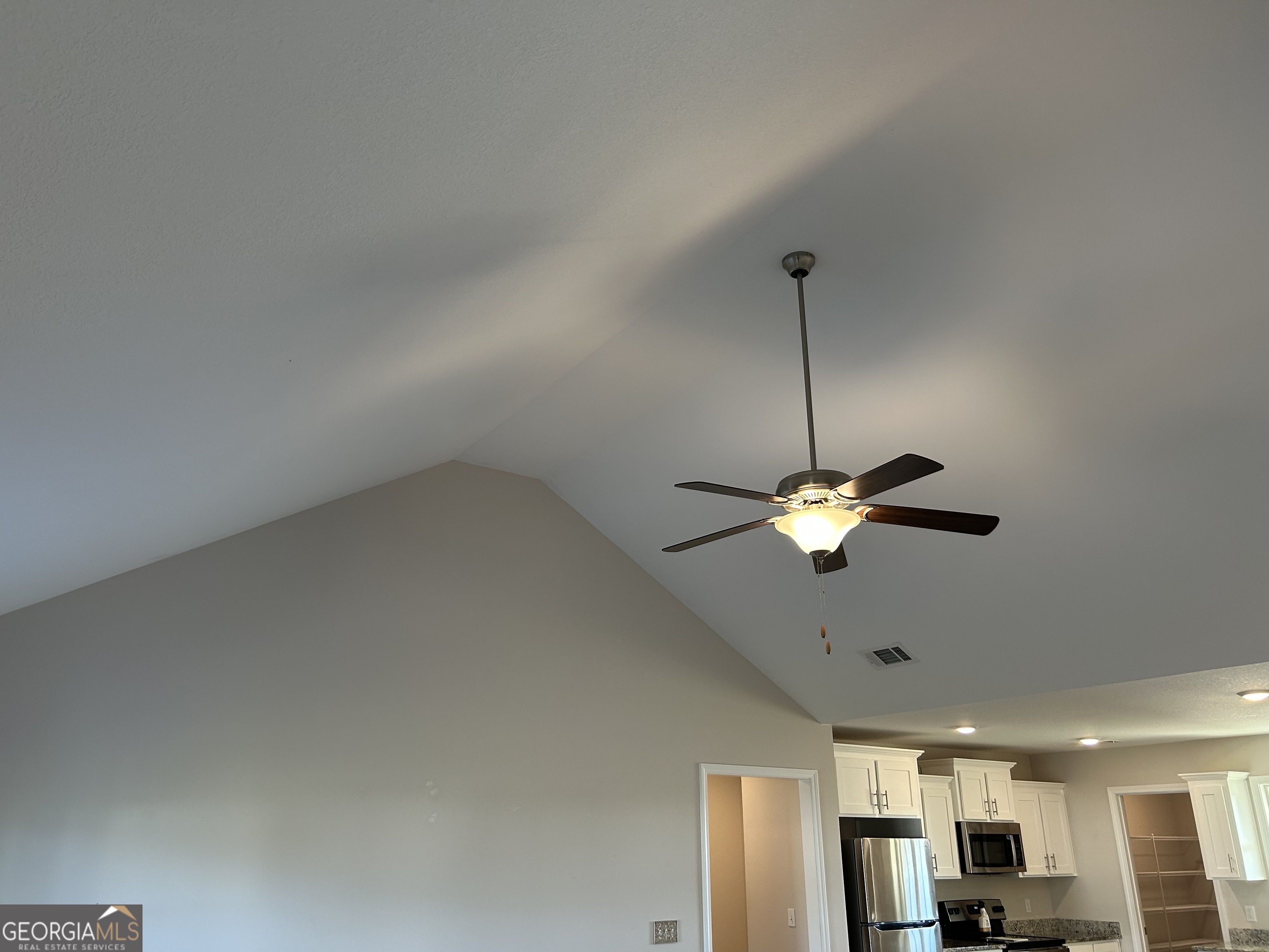 106 Old Barn Road Statesboro, GA 30458 - Photo 14 of 59 a view of a livingroom with furniture and chandelier fan