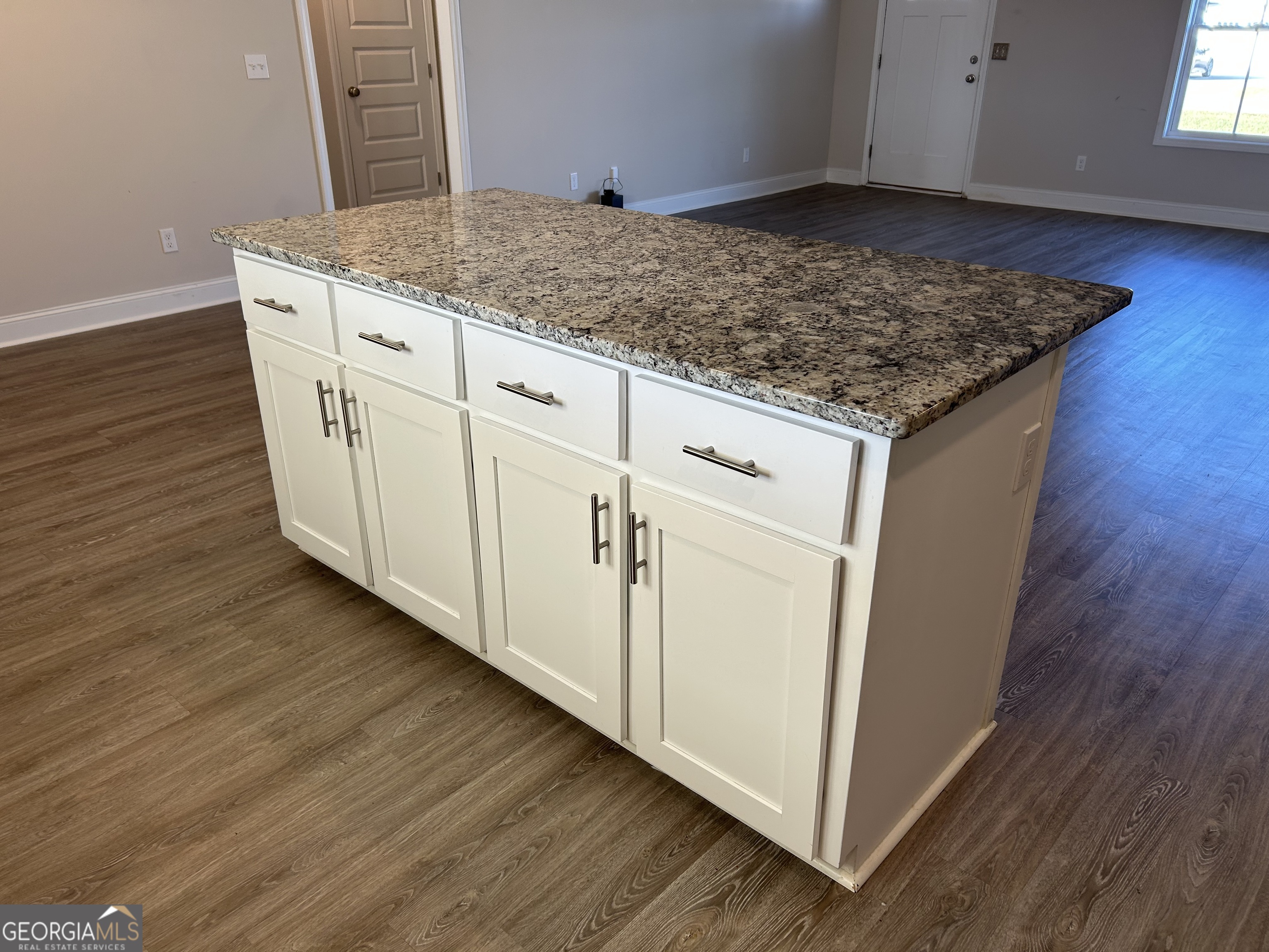 106 Old Barn Road Statesboro, GA 30458 - Photo 20 of 59 a view hallway with granite countertop cabinets and wooden floor