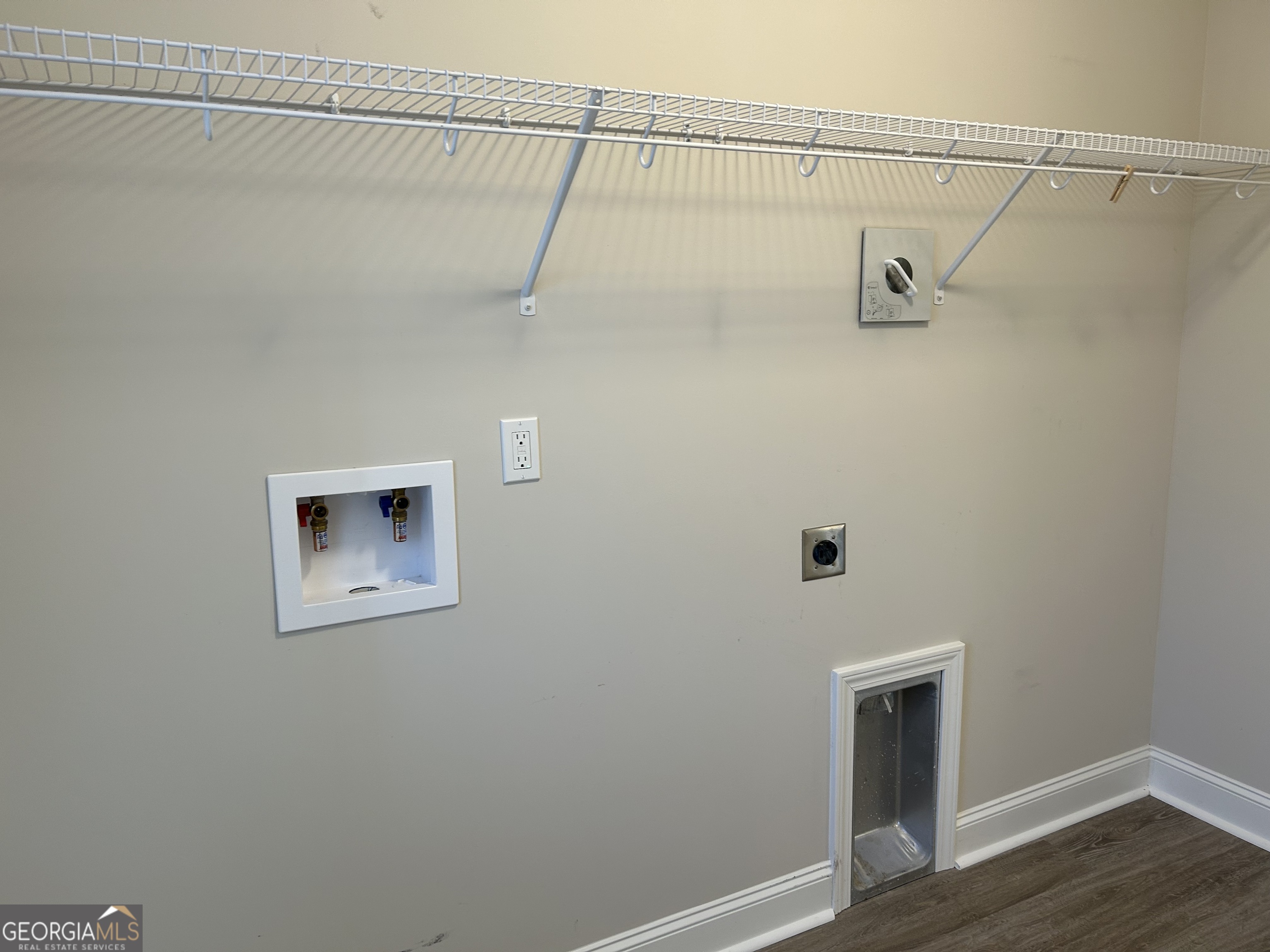 106 Old Barn Road Statesboro, GA 30458 - Photo 25 of 59 a view of a room with racks on the wall