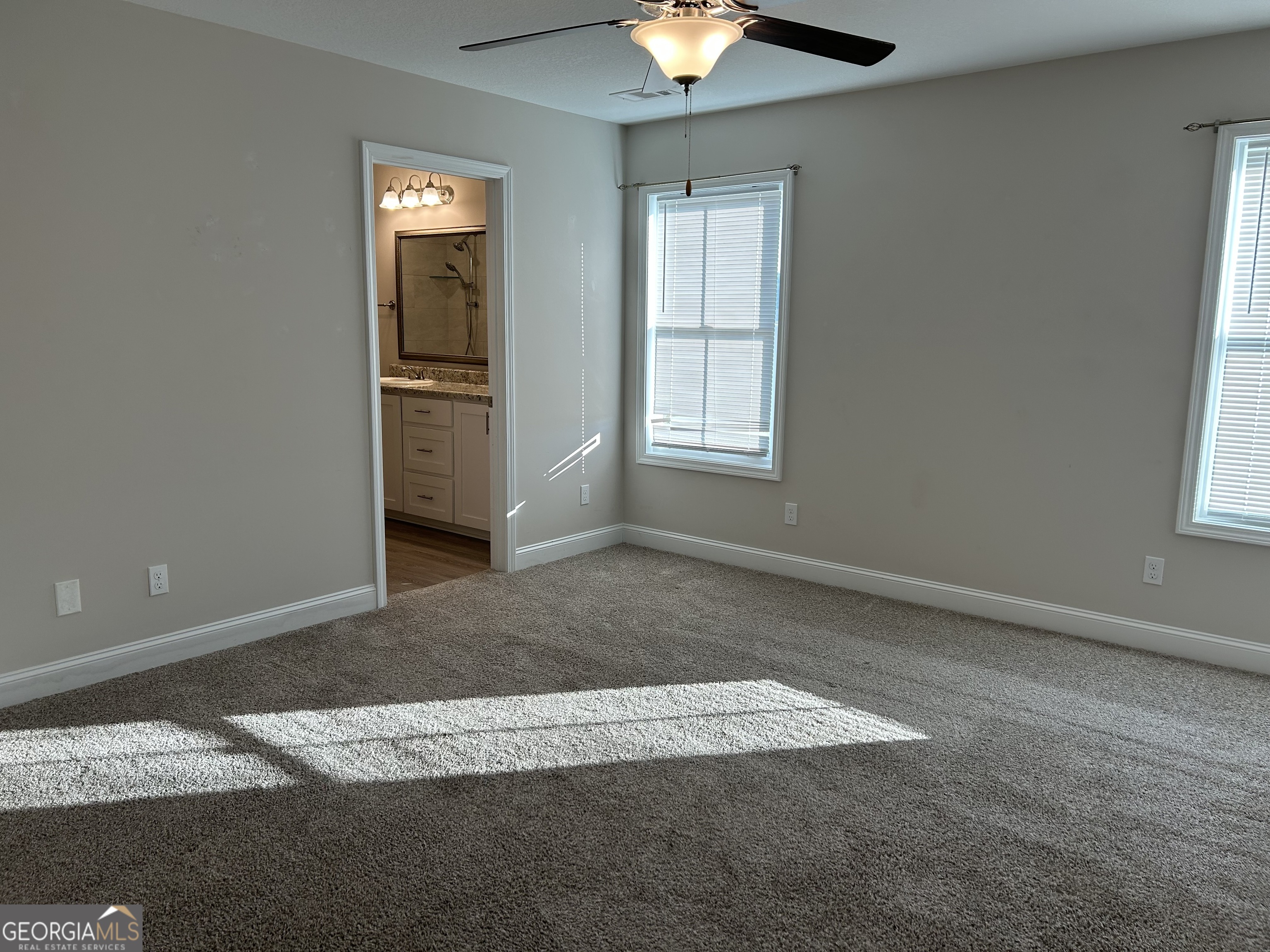 106 Old Barn Road Statesboro, GA 30458 - Photo 28 of 59 an empty room with windows and closet