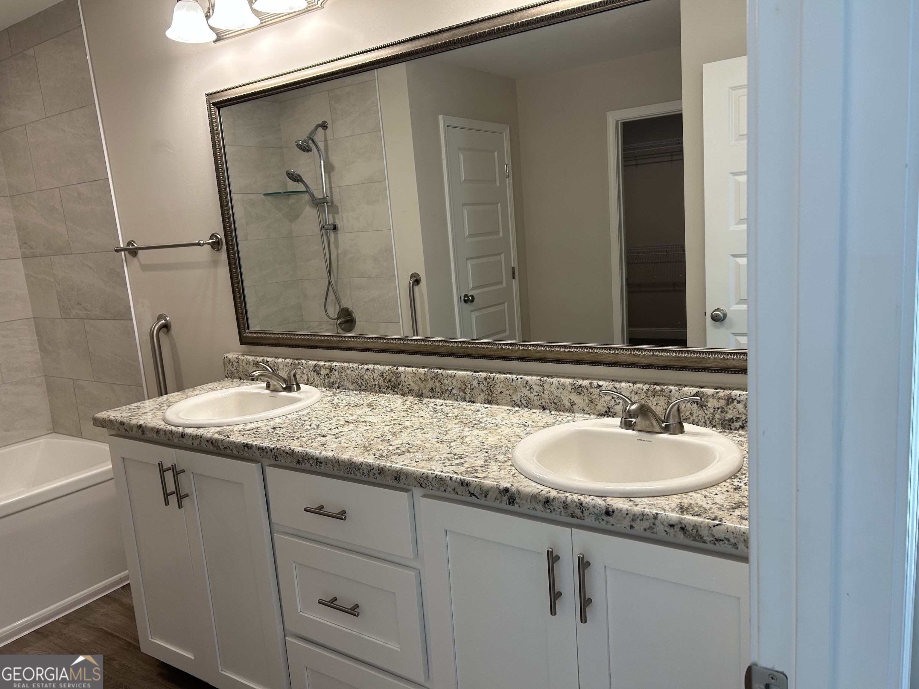 106 Old Barn Road Statesboro, GA 30458 - Photo 31 of 59 a bathroom with a granite countertop sink and a mirror