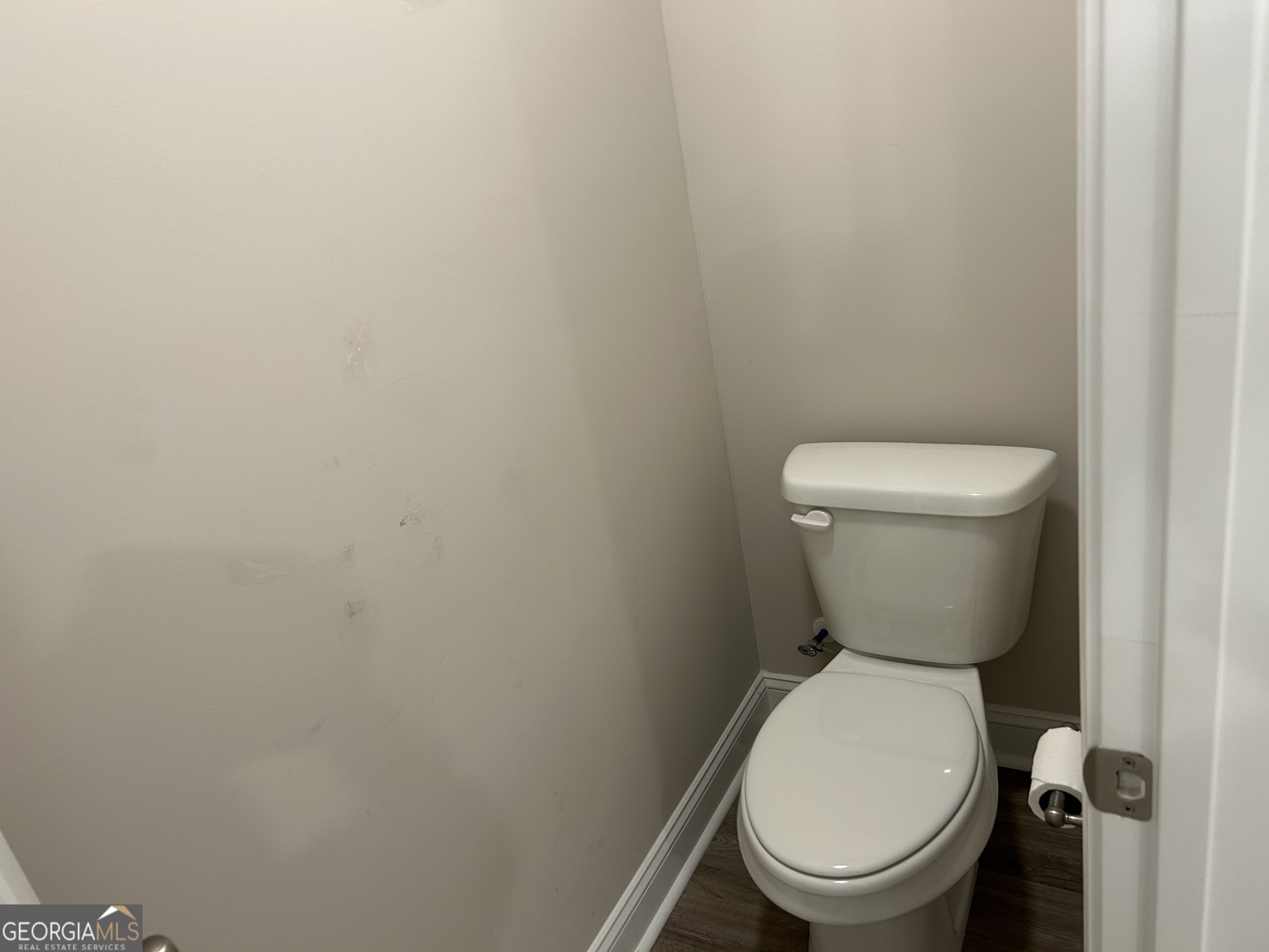 106 Old Barn Road Statesboro, GA 30458 - Photo 34 of 59 a white toilet sitting next to a white wall