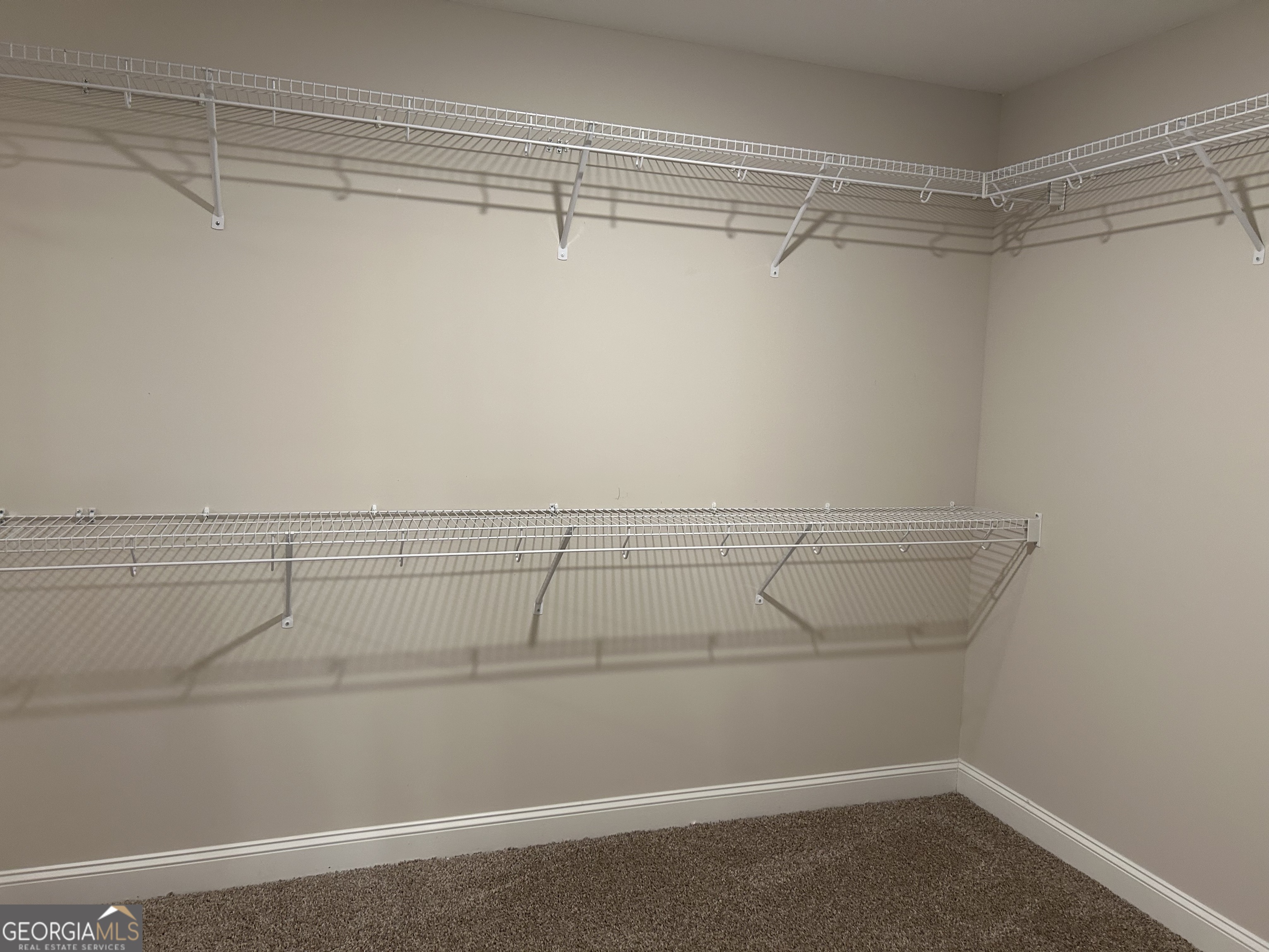 106 Old Barn Road Statesboro, GA 30458 - Photo 36 of 59 a view of a room with racks on the wall