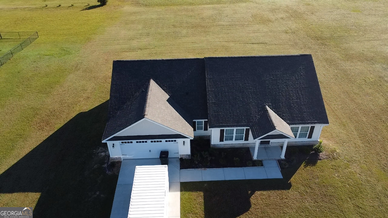 106 Old Barn Road Statesboro, GA 30458 - Photo 4 of 59 a terrace of a building with lawn chairs