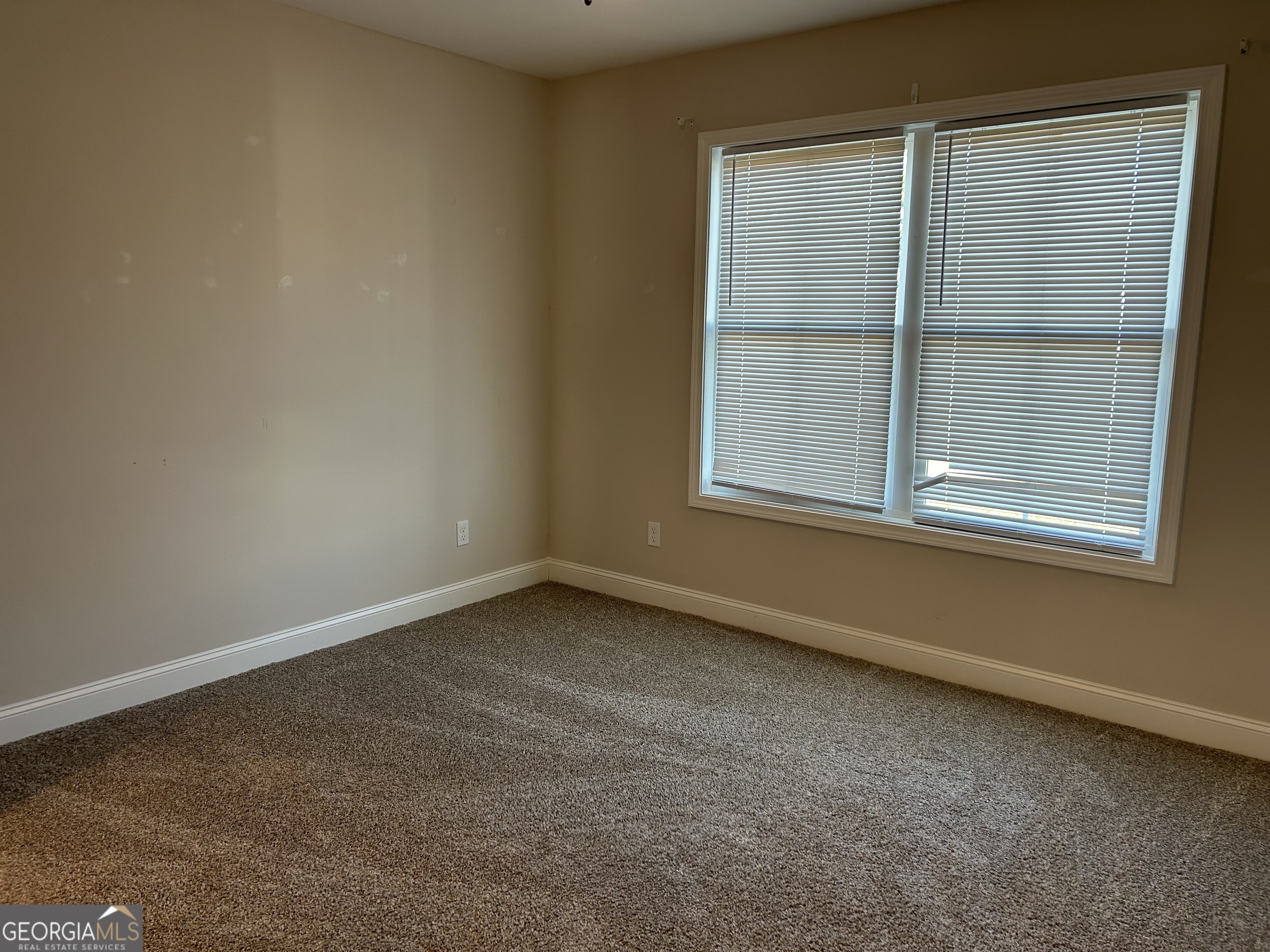 106 Old Barn Road Statesboro, GA 30458 - Photo 41 of 59 an empty room with a window