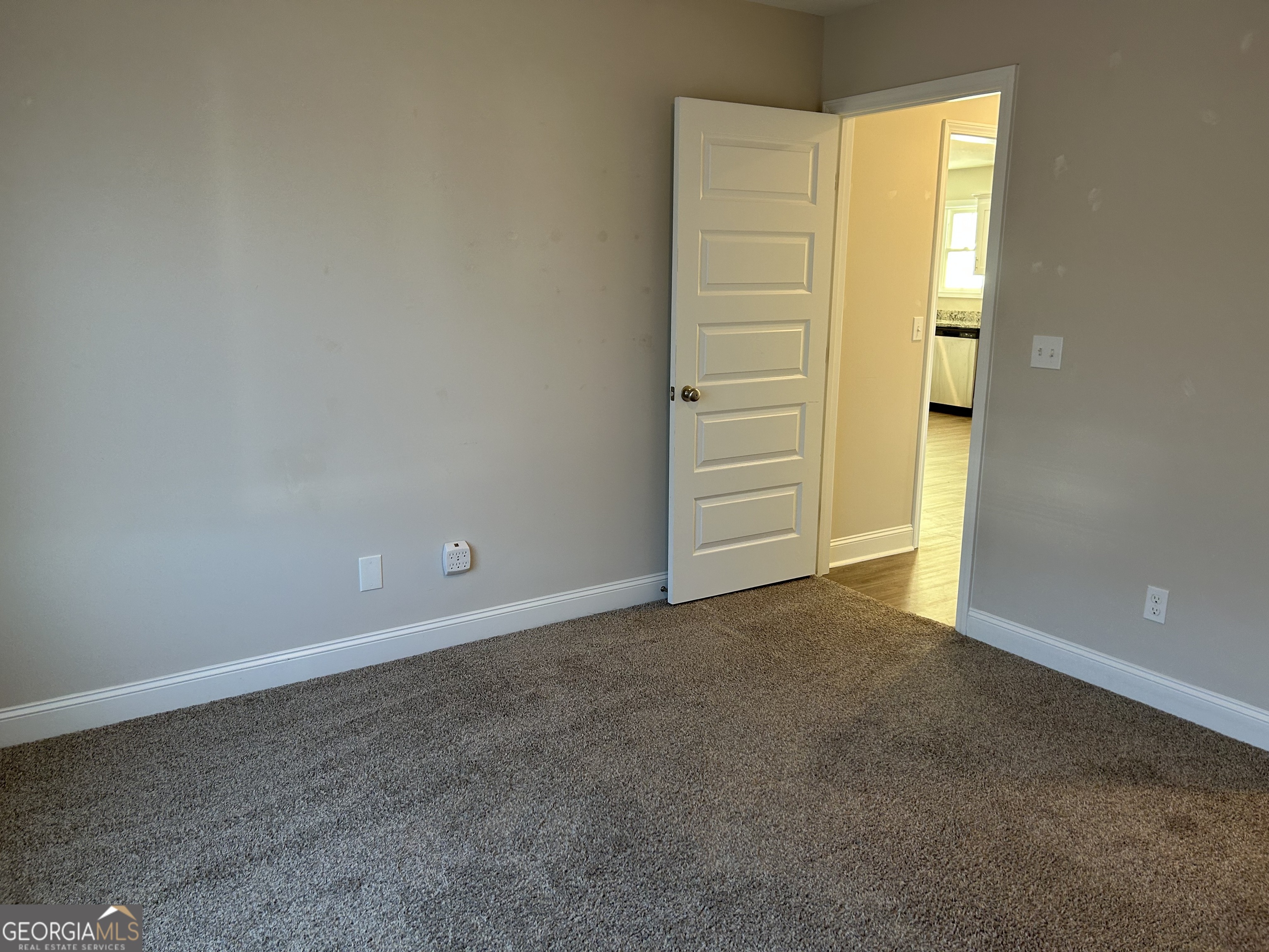 106 Old Barn Road Statesboro, GA 30458 - Photo 42 of 59 an empty room with closet and mirror