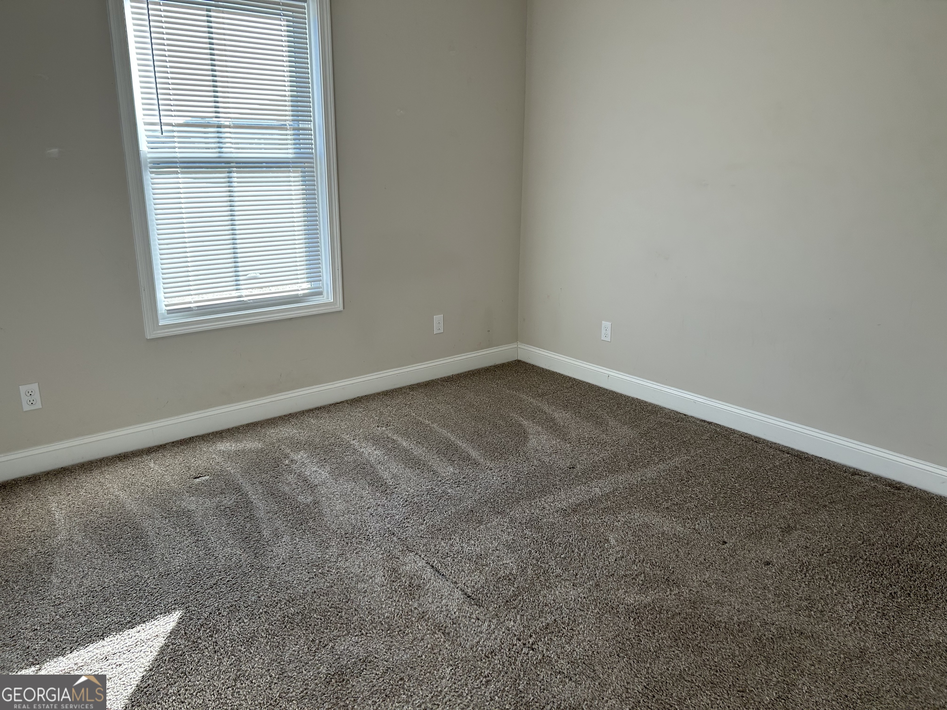 106 Old Barn Road Statesboro, GA 30458 - Photo 45 of 59 an empty room with a window