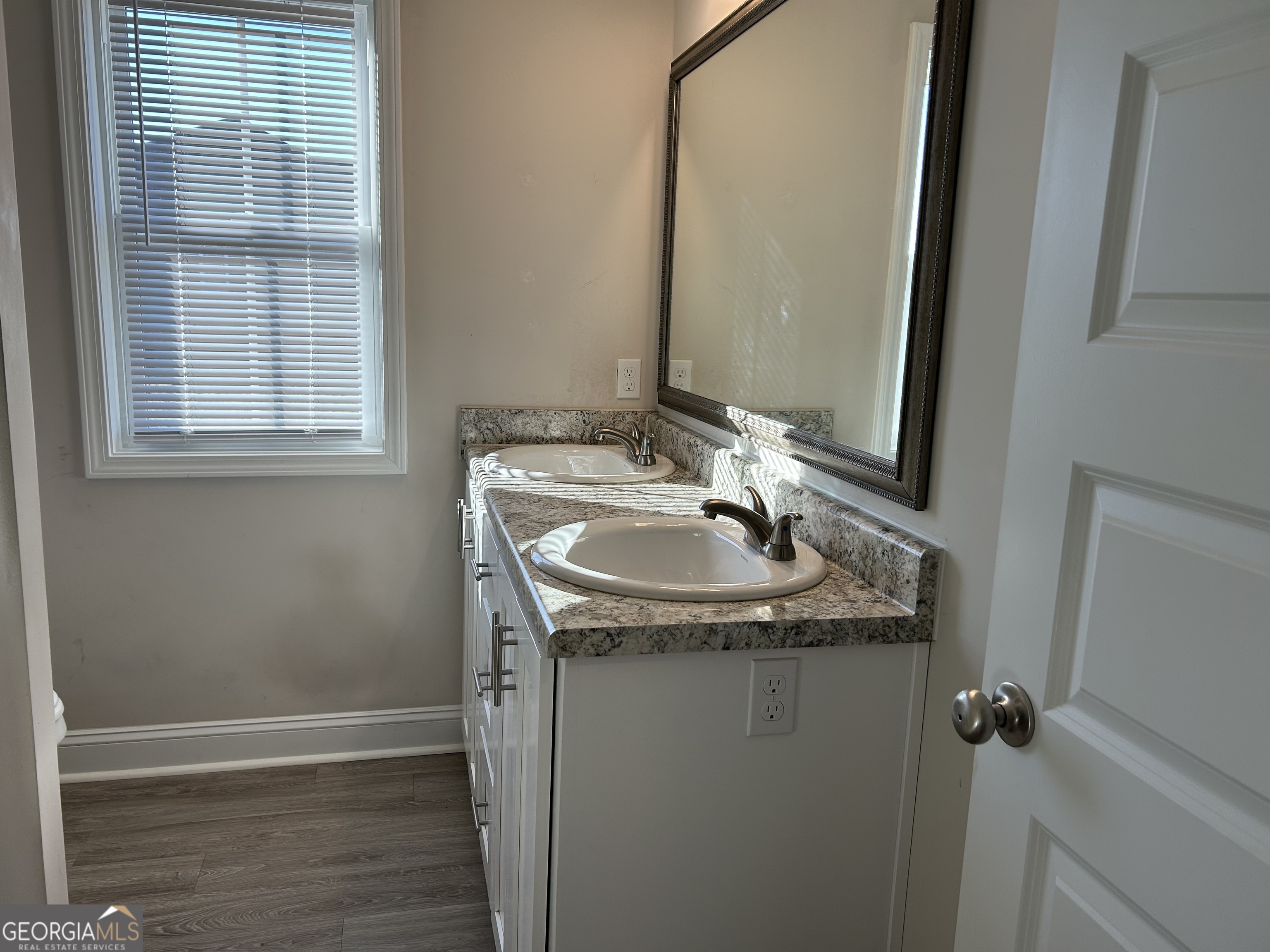 106 Old Barn Road Statesboro, GA 30458 - Photo 51 of 59 a bathroom with a granite countertop sink and a mirror
