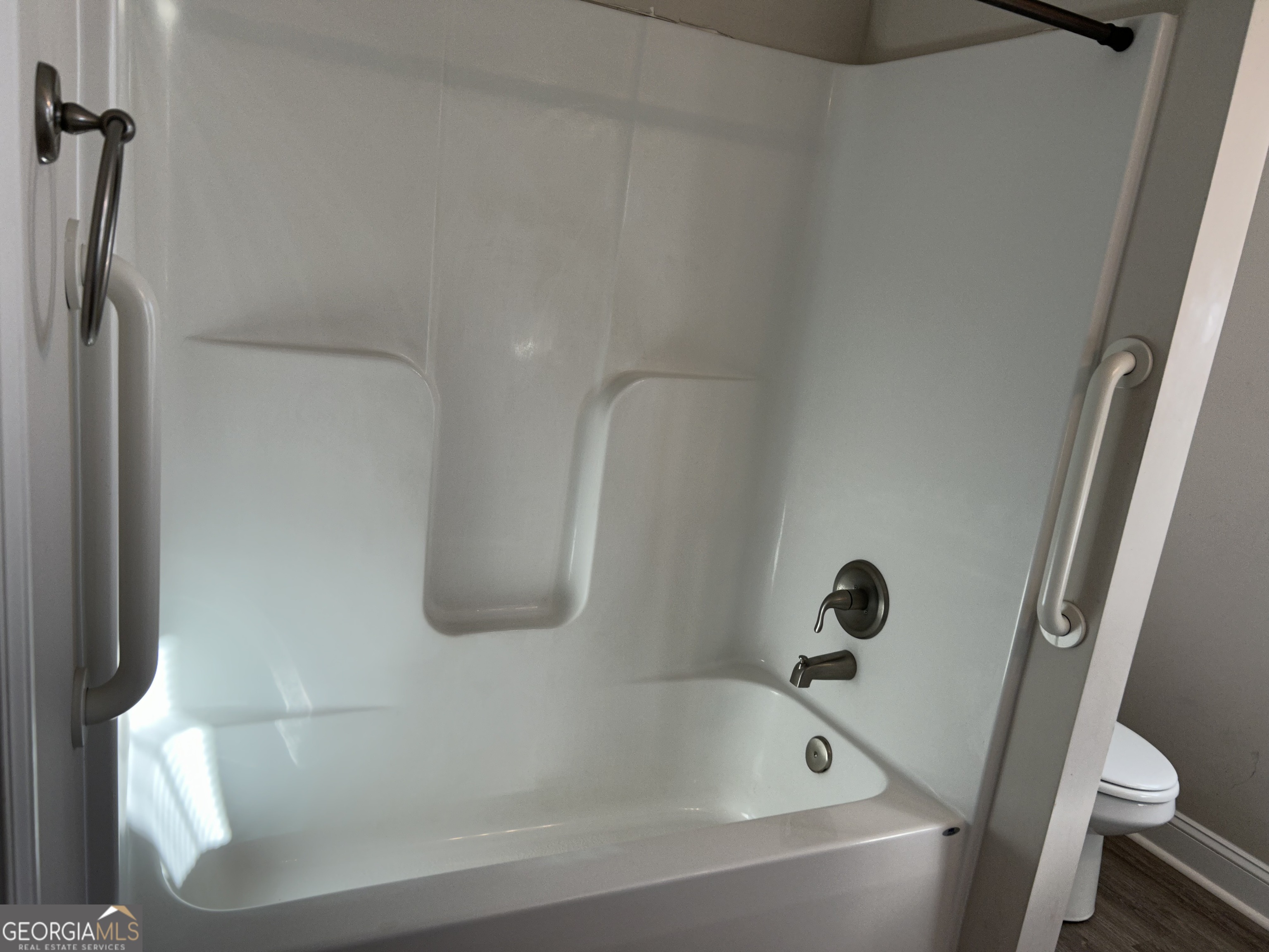 106 Old Barn Road Statesboro, GA 30458 - Photo 52 of 59 a white bath tub sitting next to a white toilet and sink