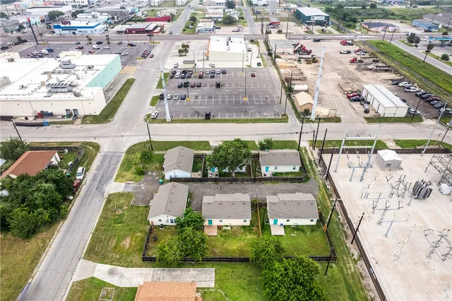an aerial view of residential houses with outdoor space