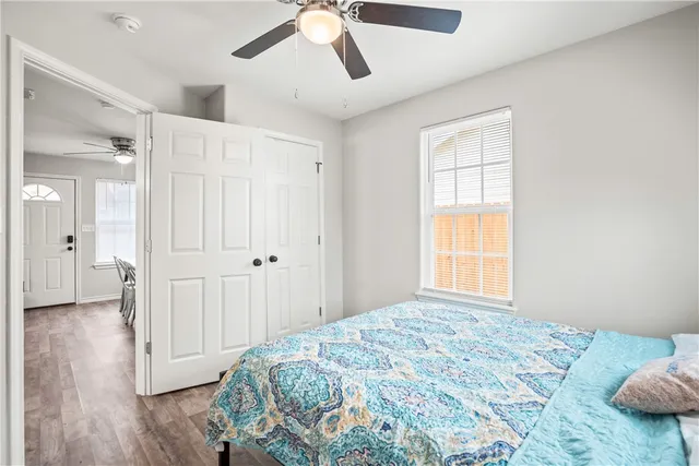 a bedroom with a bed and a window