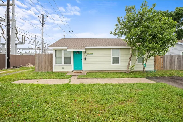 a view of a backyard with a garden and plants