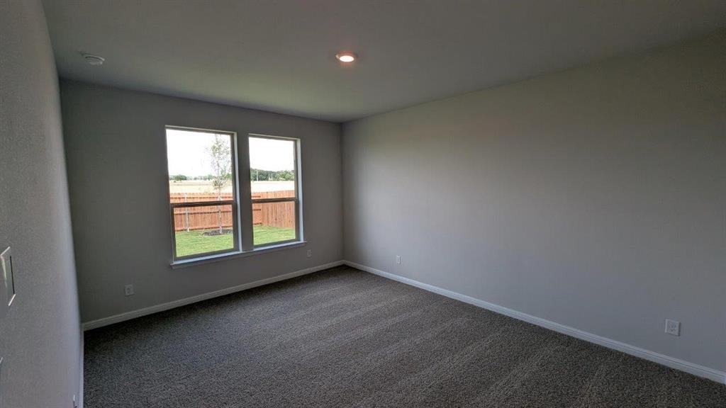 1021 Traction Trail Cleburne, TX 76031 - Photo 5 of 16 an empty room with a window
