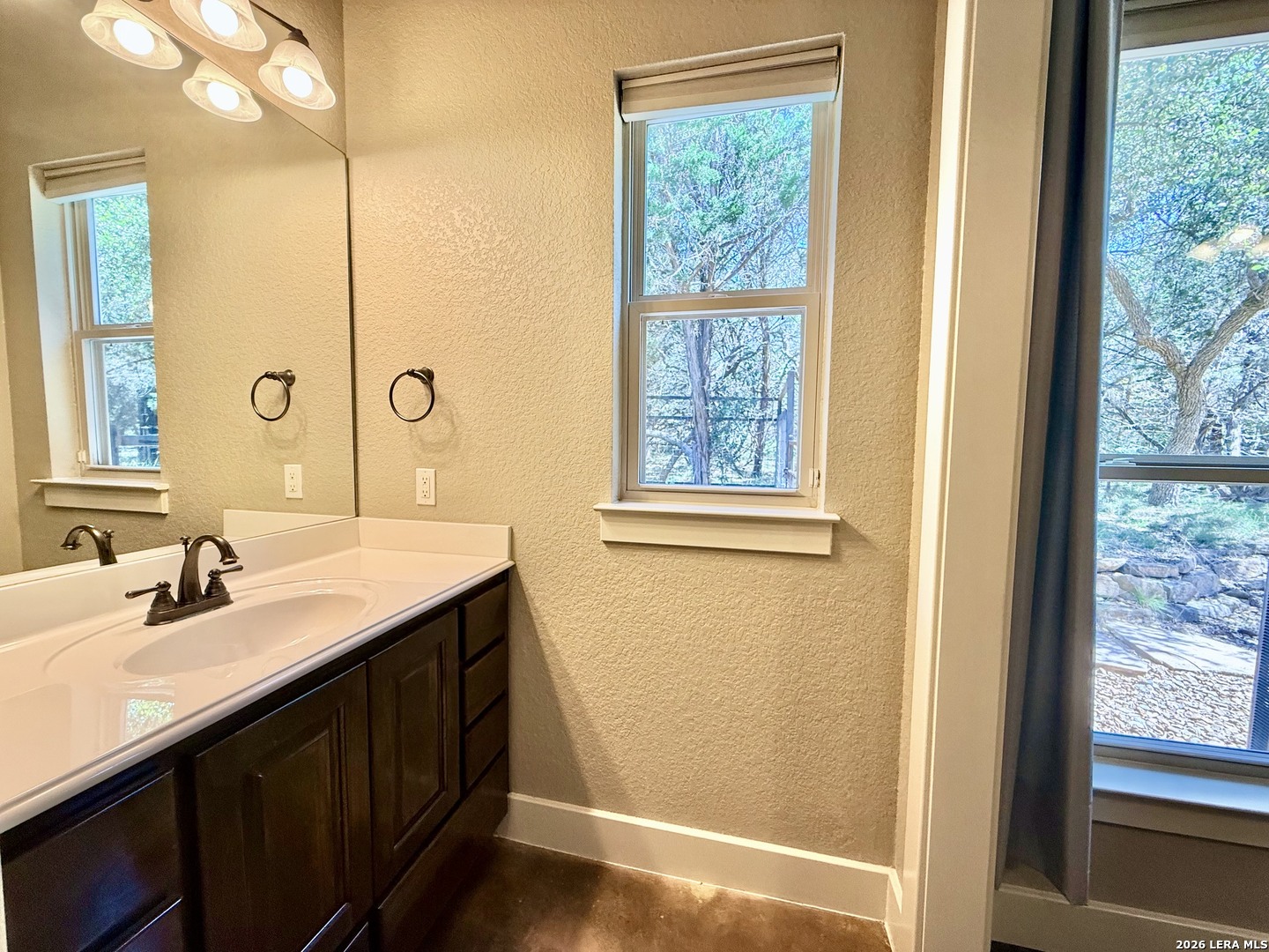 757 Copper Rim Spring Branch, TX 78070 - Photo 31 of 50 a bathroom with a sink and a mirror