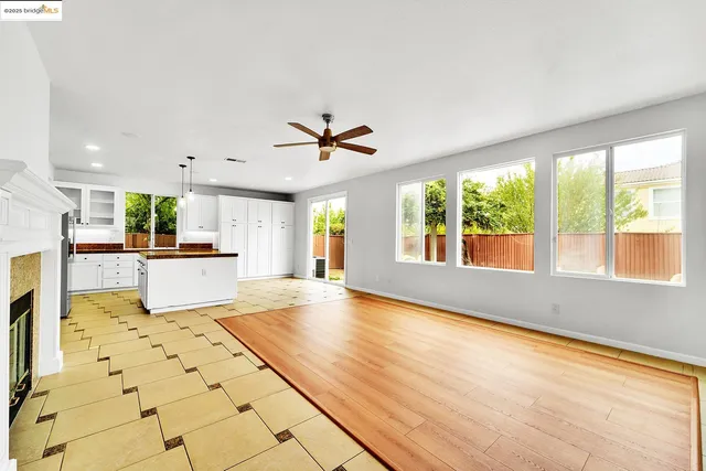 a view of kitchen with furniture and wooden floor