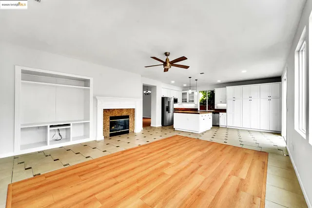 a large white bed in a white room