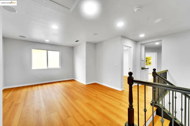 a bedroom with a bed and a television