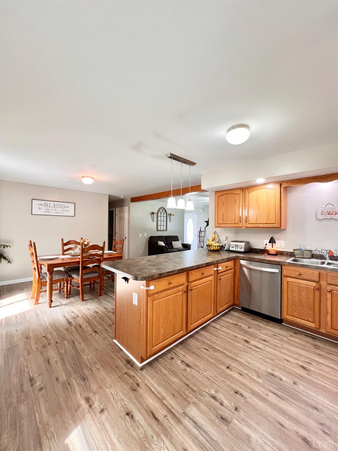 102 Fawn Court Amherst, VA 24521 - Photo 13 of 64 a kitchen with stainless steel appliances granite countertop a sink and cabinets