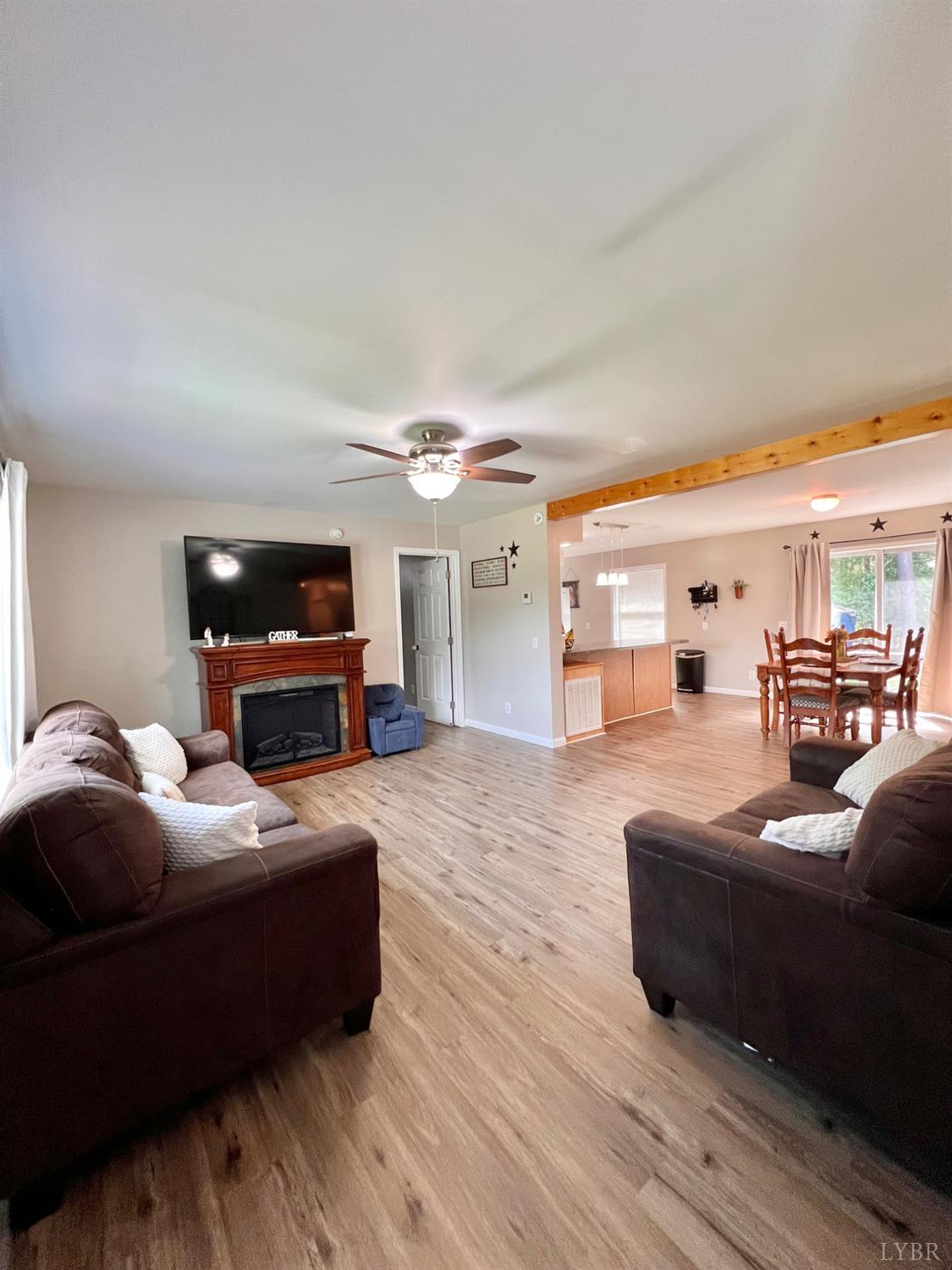 102 Fawn Court Amherst, VA 24521 - Photo 19 of 64 a bedroom with furniture and a wooden floor