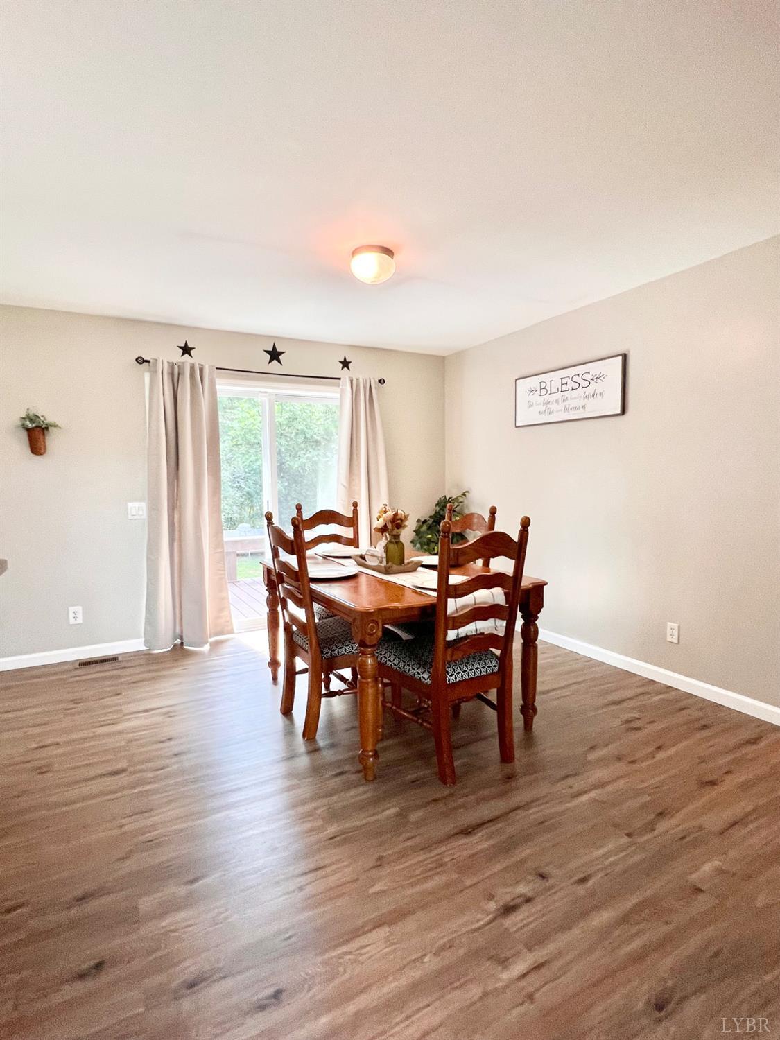 102 Fawn Court Amherst, VA 24521 - Photo 22 of 64 a view of a a dining room with furniture window and wooden floor