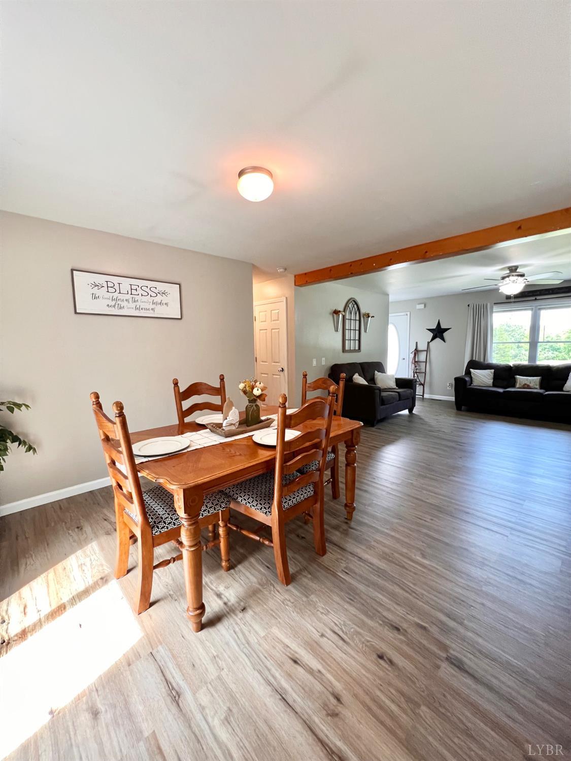 102 Fawn Court Amherst, VA 24521 - Photo 24 of 64 a living room with furniture a wooden floor and next to a window