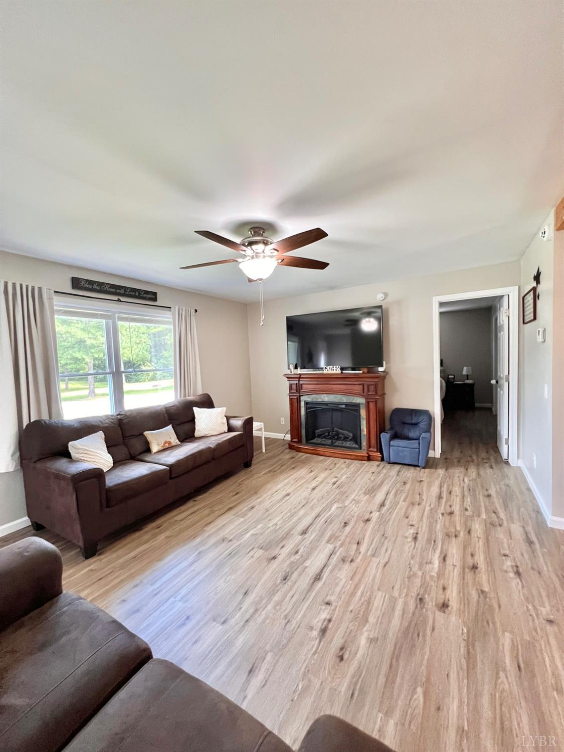 102 Fawn Court Amherst, VA 24521 - Photo 25 of 64 a living room with furniture and a fireplace