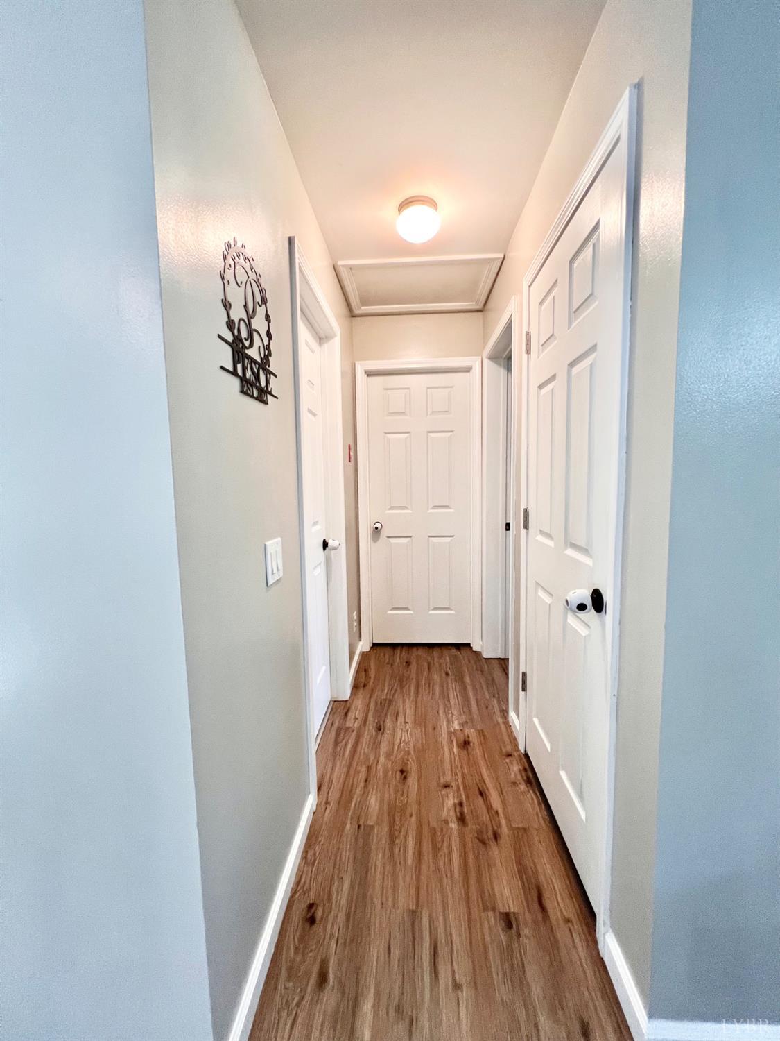 102 Fawn Court Amherst, VA 24521 - Photo 27 of 64 a view of a hallway with wooden floor and staircase