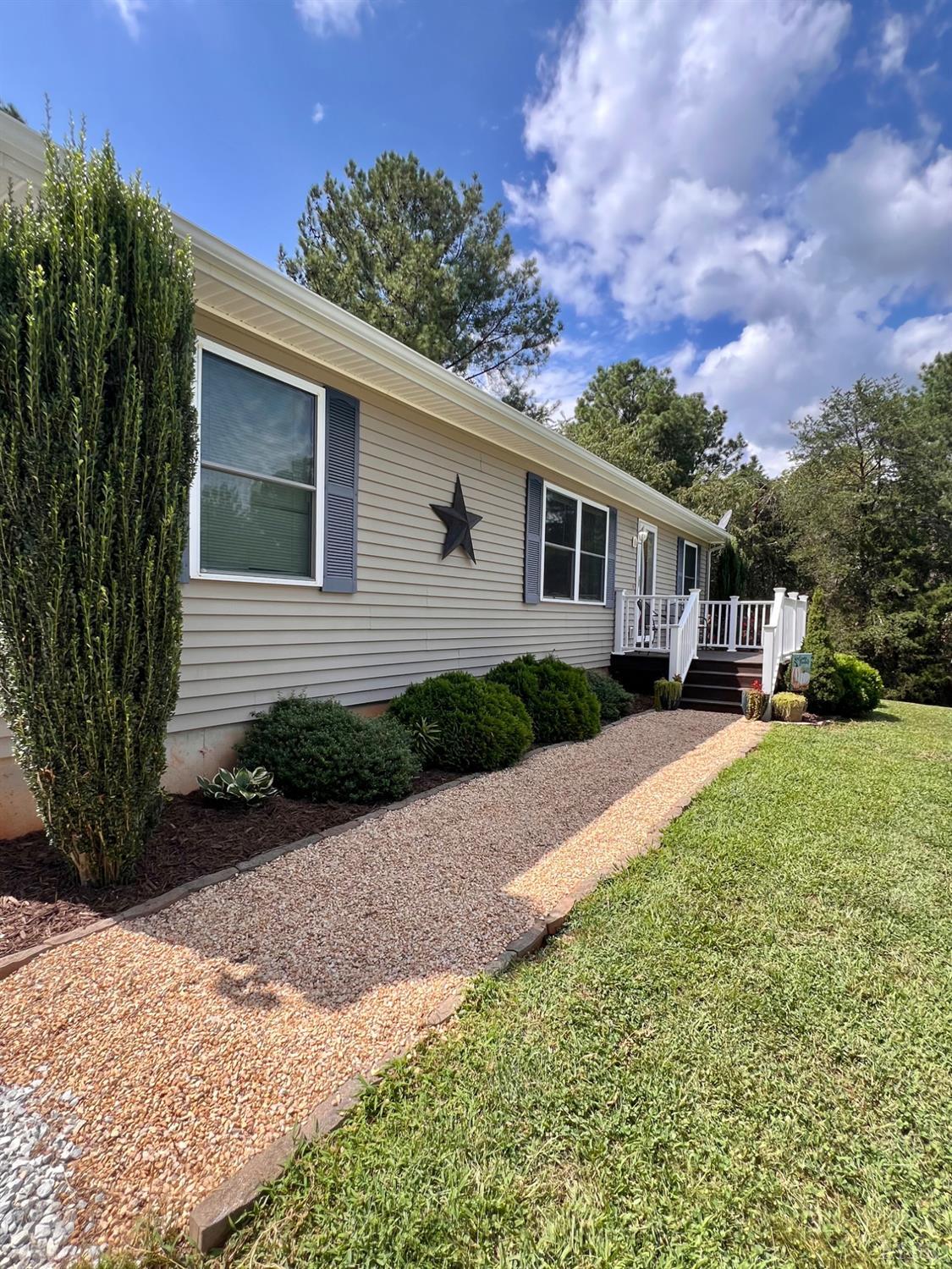 102 Fawn Court Amherst, VA 24521 - Photo 3 of 64 a front view of a house with a yard and potted plants