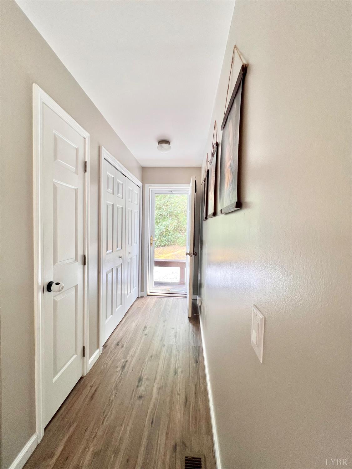 102 Fawn Court Amherst, VA 24521 - Photo 38 of 64 a view of a hallway with wooden floor and staircase