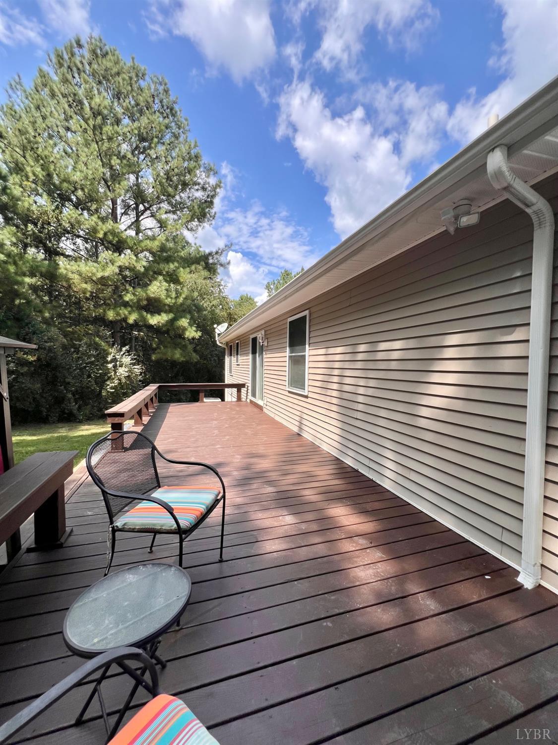 102 Fawn Court Amherst, VA 24521 - Photo 40 of 64 a view of a chairs and tables in the back yard of the house