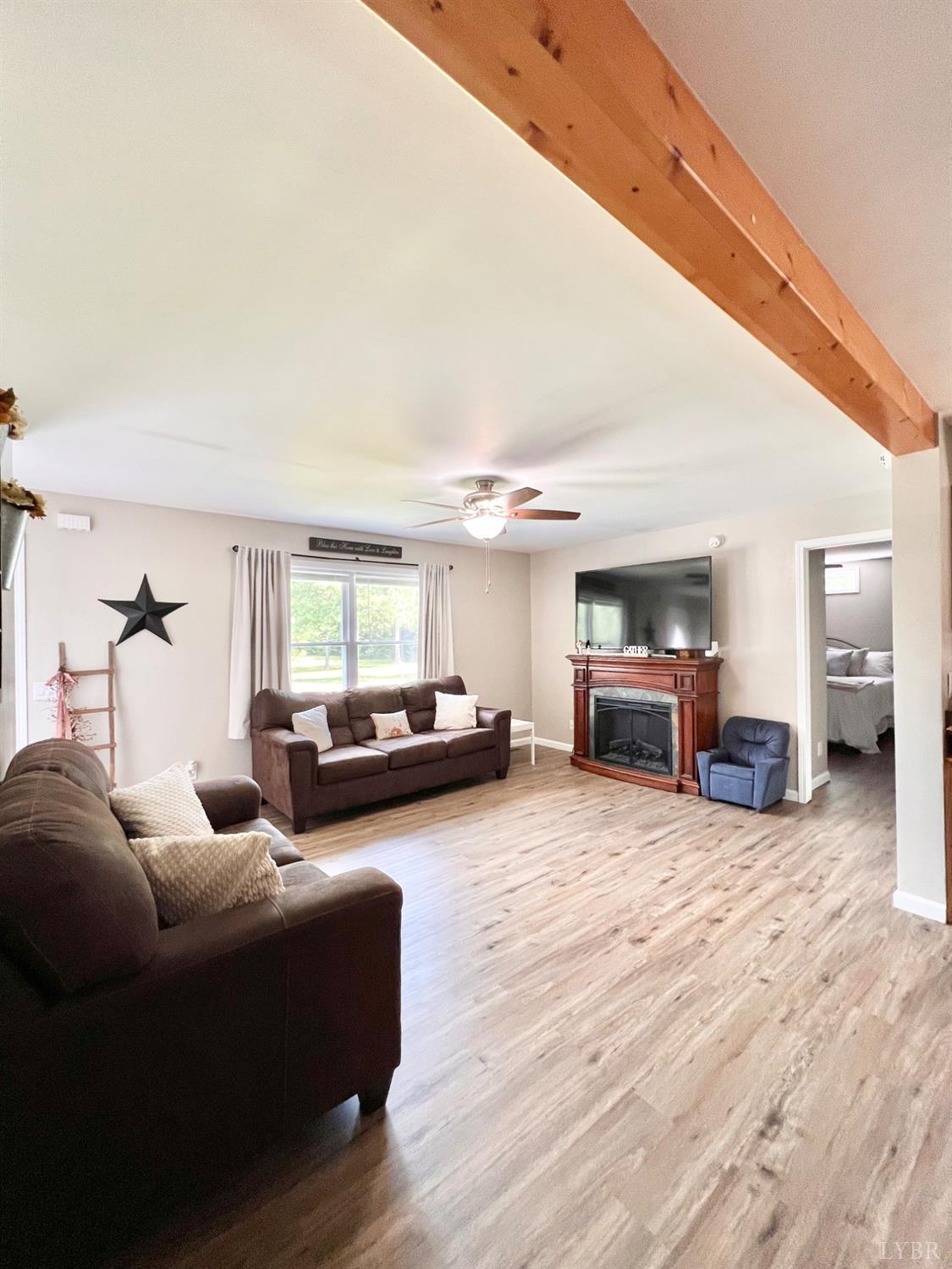 102 Fawn Court Amherst, VA 24521 - Photo 10 of 64 a living room with furniture and a fireplace