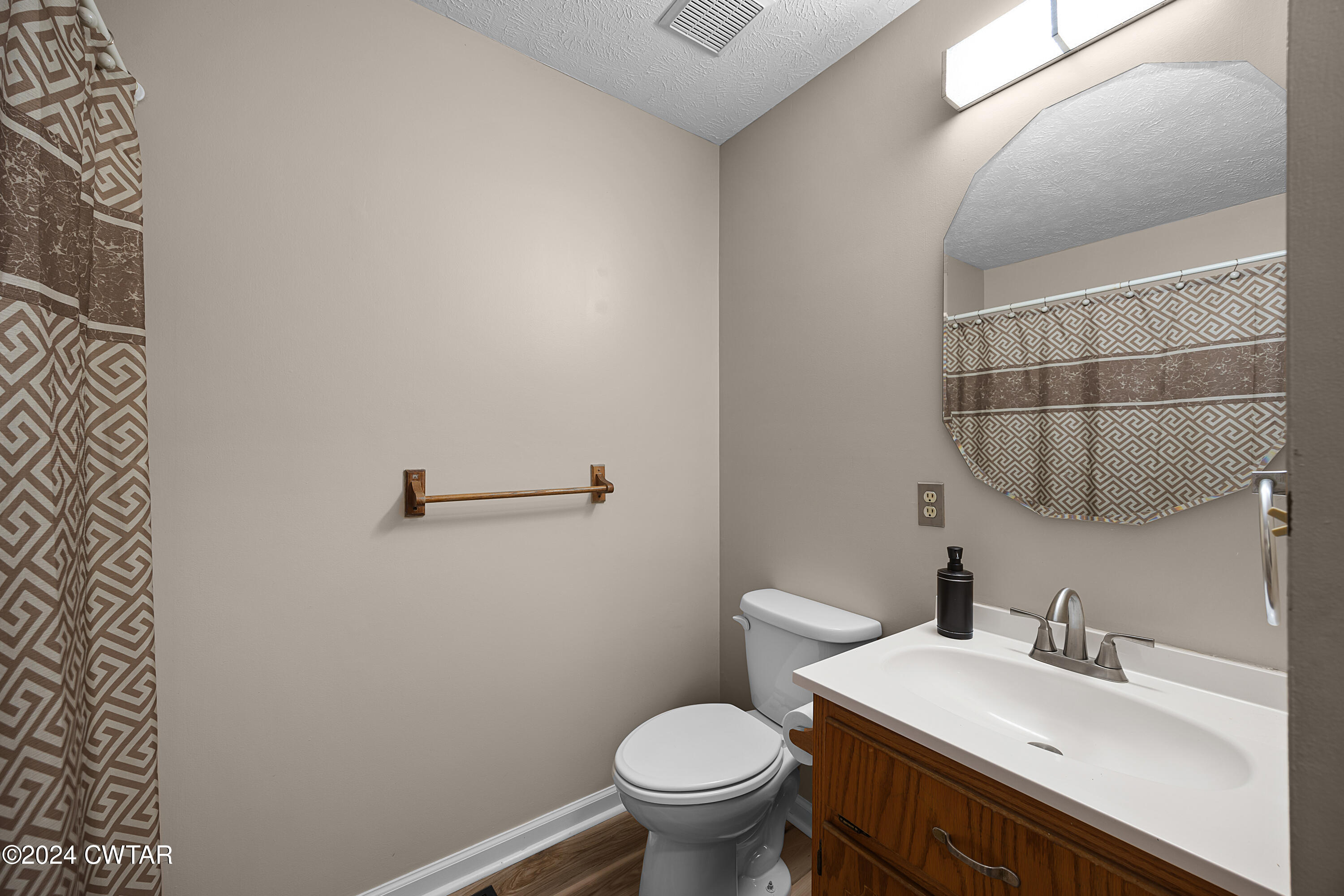 650 Gobelet Road Medon, TN 38356 - Photo 16 of 21 a bathroom with a sink a toilet and a mirror