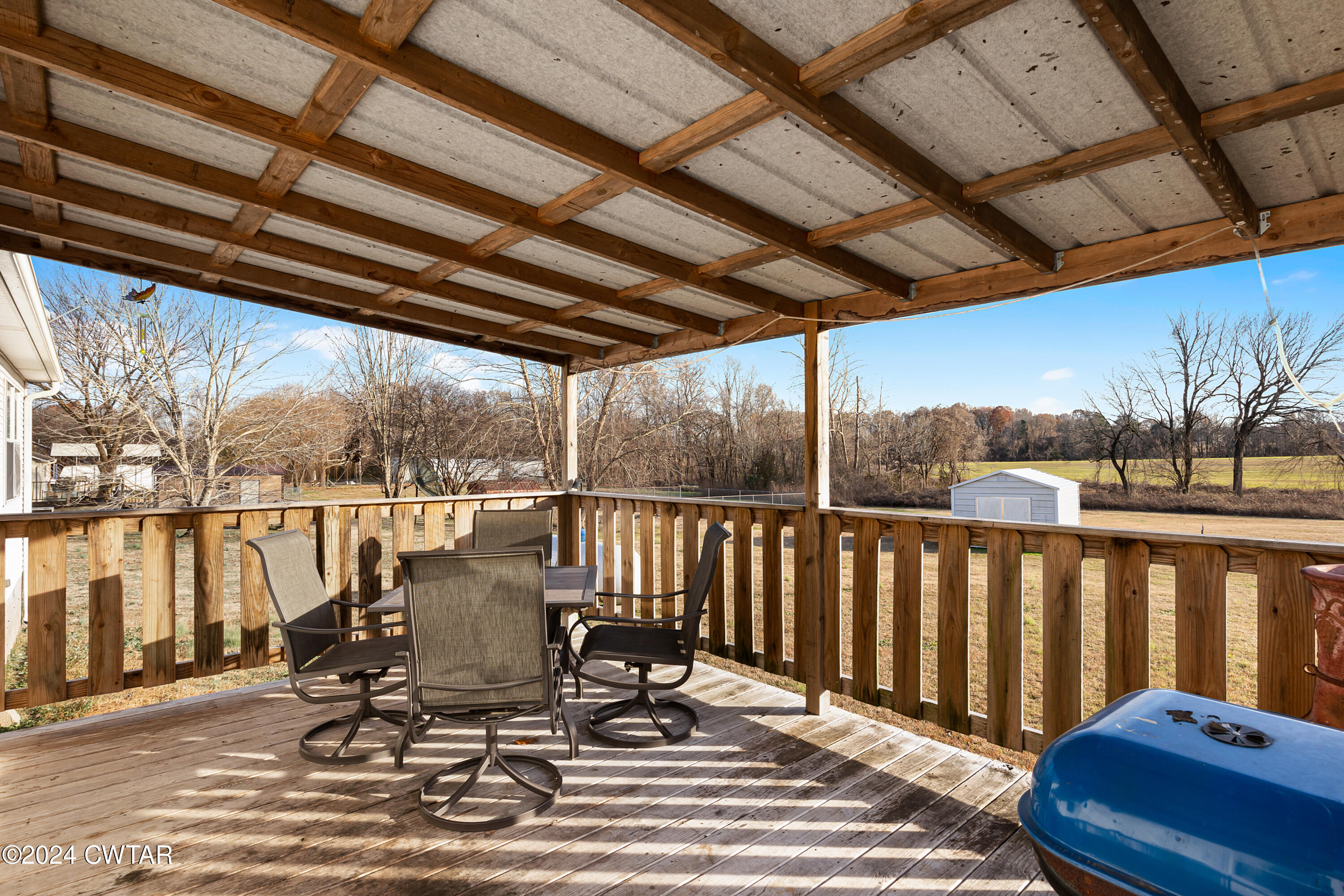 650 Gobelet Road Medon, TN 38356 - Photo 18 of 21 a view of a balcony with chairs and wooden floor