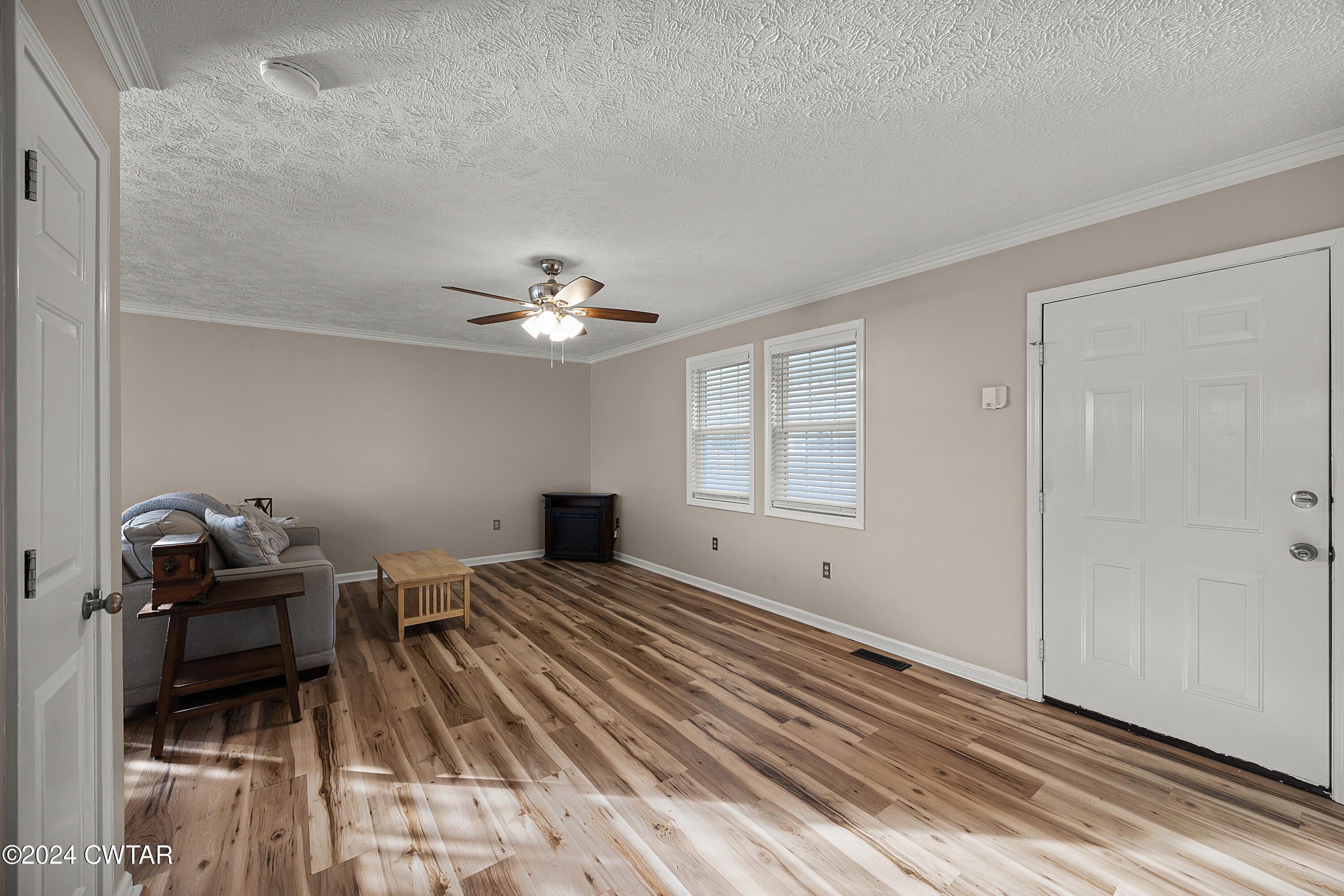 650 Gobelet Road Medon, TN 38356 - Photo 5 of 21 a view of a livingroom with furniture and wooden floor