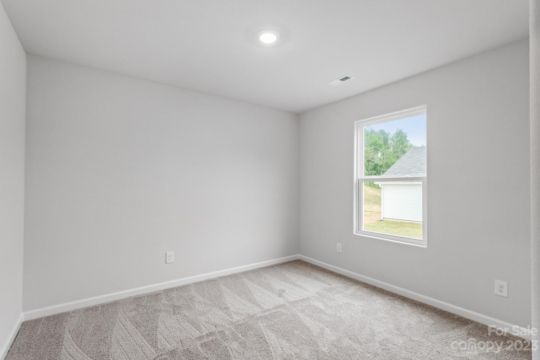 1716 Nia Road Charlotte, NC 28215 - Photo 8 of 10 an empty room with a window
