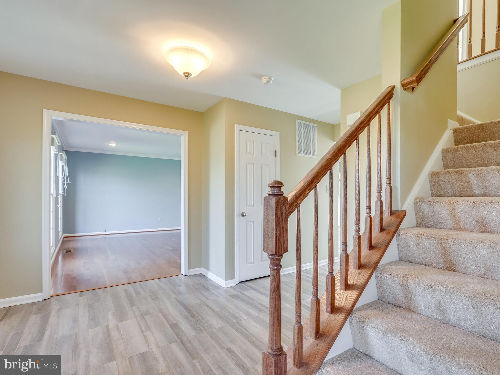 16910 Hoskinson Road Poolesville, MD 20837 - Photo 15 of 30 a view of staircase with wooden floor and stairs