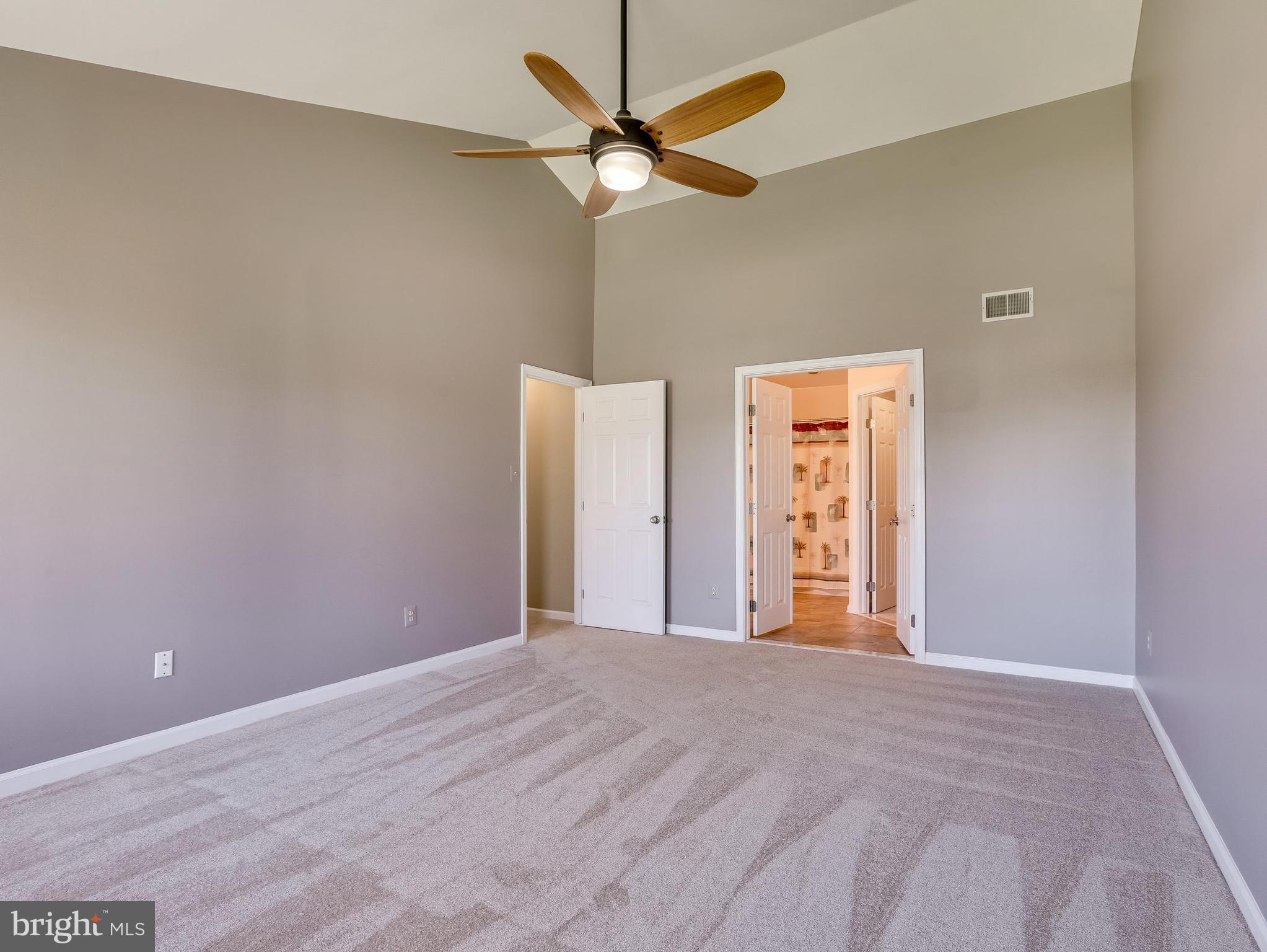 16910 Hoskinson Road Poolesville, MD 20837 - Photo 20 of 30 a view of a livingroom with a chandelier fan