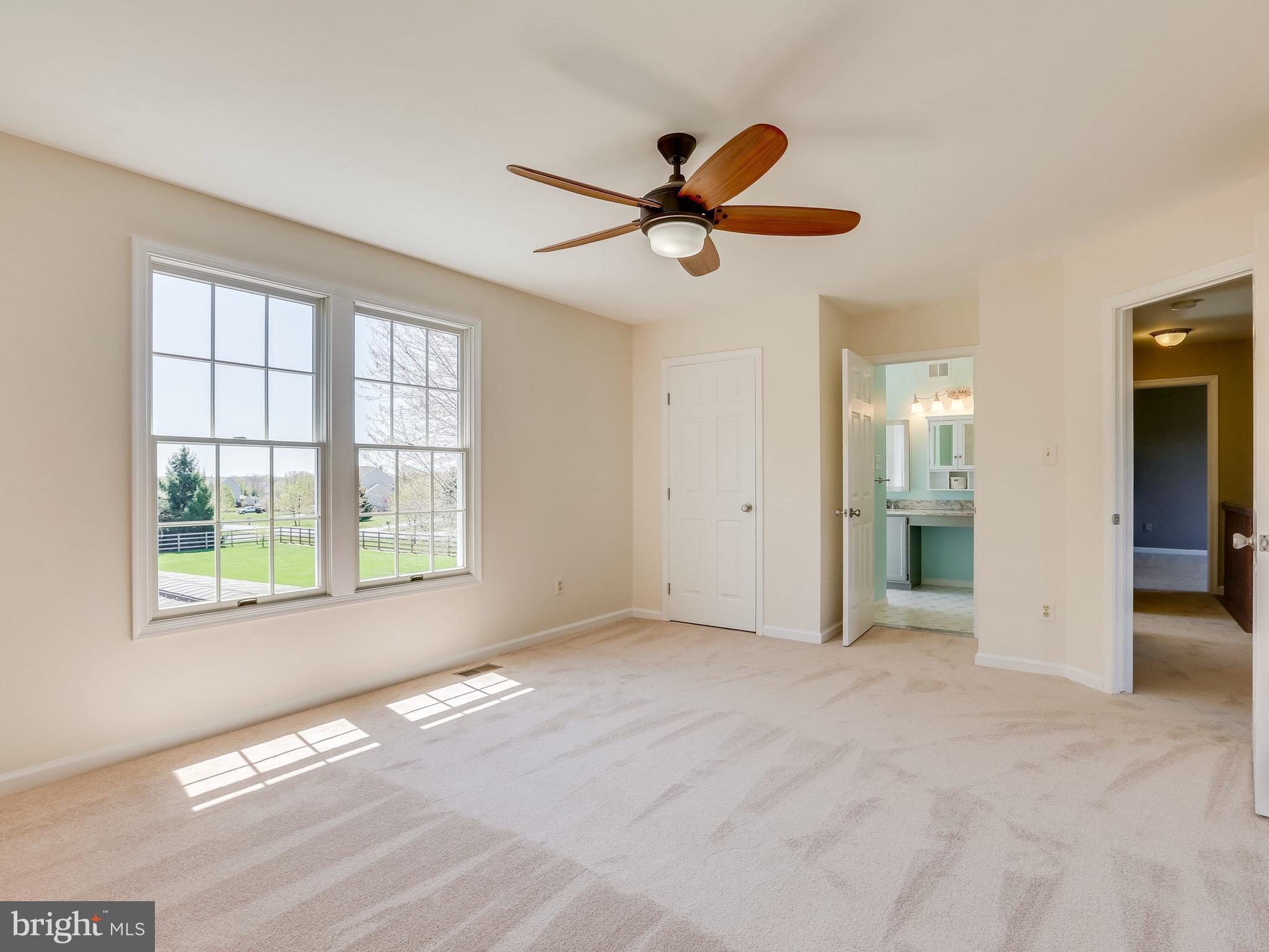 16910 Hoskinson Road Poolesville, MD 20837 - Photo 23 of 30 wooden floor in an empty room with a window