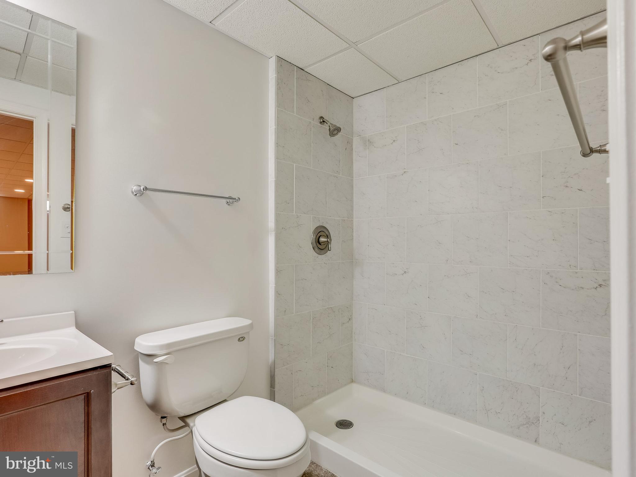 16910 Hoskinson Road Poolesville, MD 20837 - Photo 26 of 30 a white toilet sitting next to a bath tub shower
