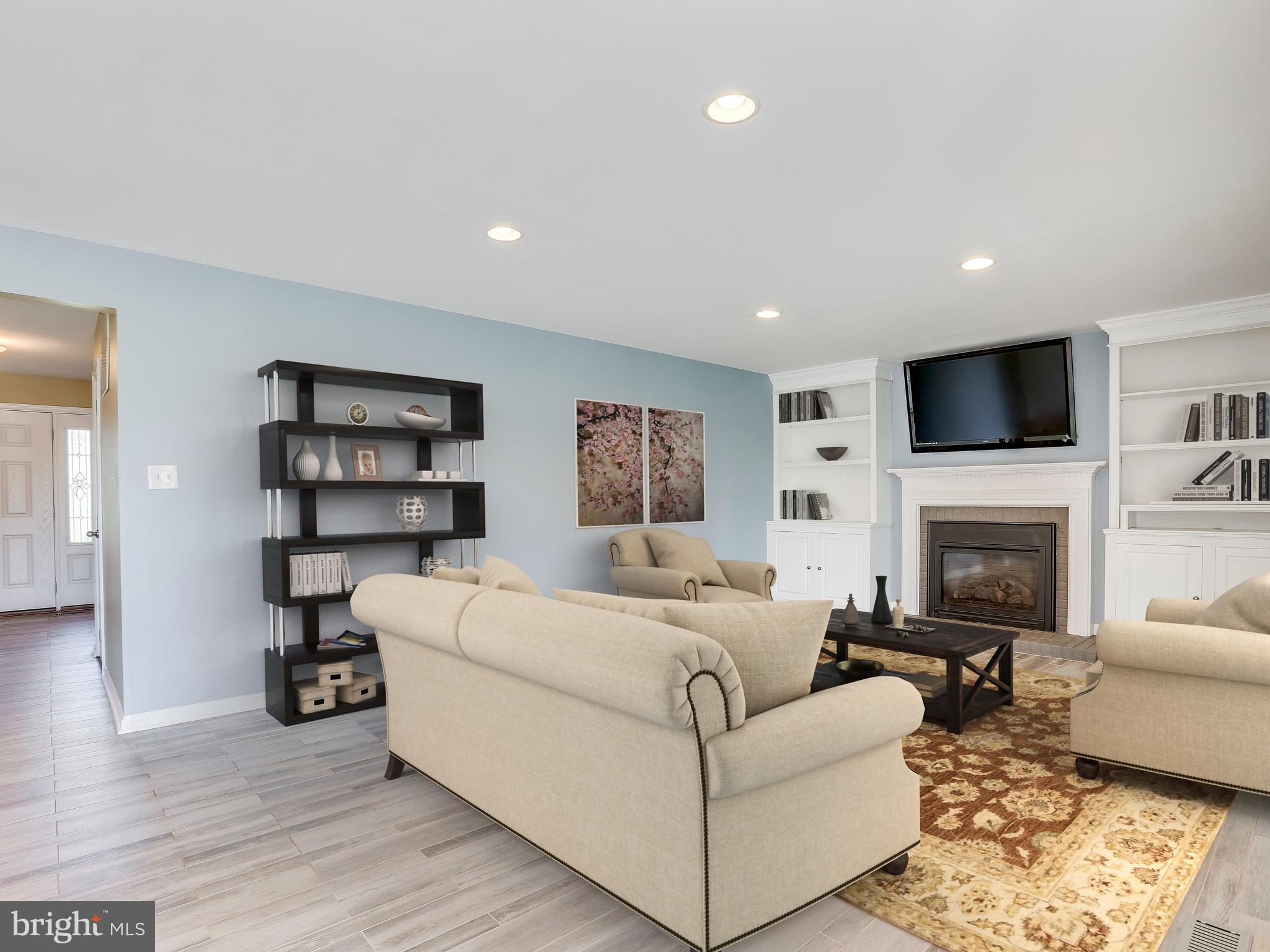 16910 Hoskinson Road Poolesville, MD 20837 - Photo 7 of 30 a living room with furniture and a fireplace
