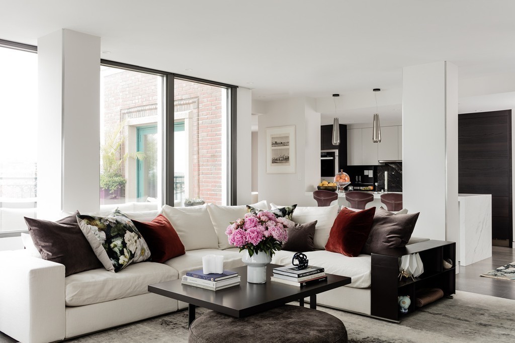 20 Rowes Wharf, Unit 610 Boston, MA 02110 - Photo 1 of 20 a living room with furniture and a large window