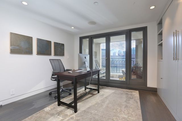 a workspace with furniture and a window