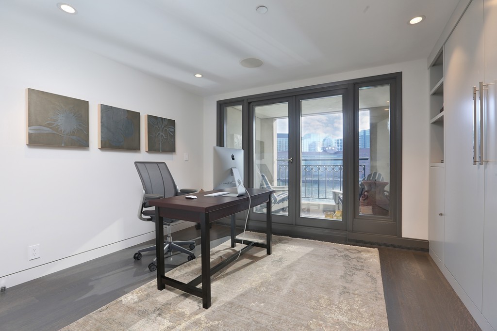 20 Rowes Wharf, Unit 610 Boston, MA 02110 - Photo 12 of 20 a workspace with furniture and a window