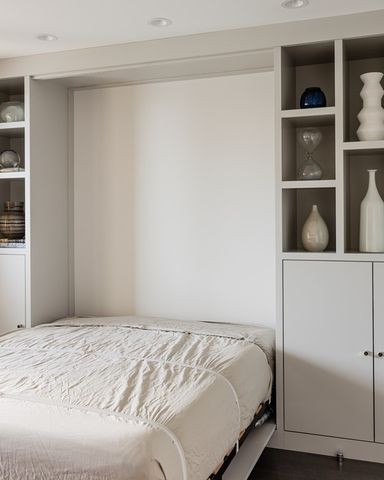 a bedroom with a bed and closet