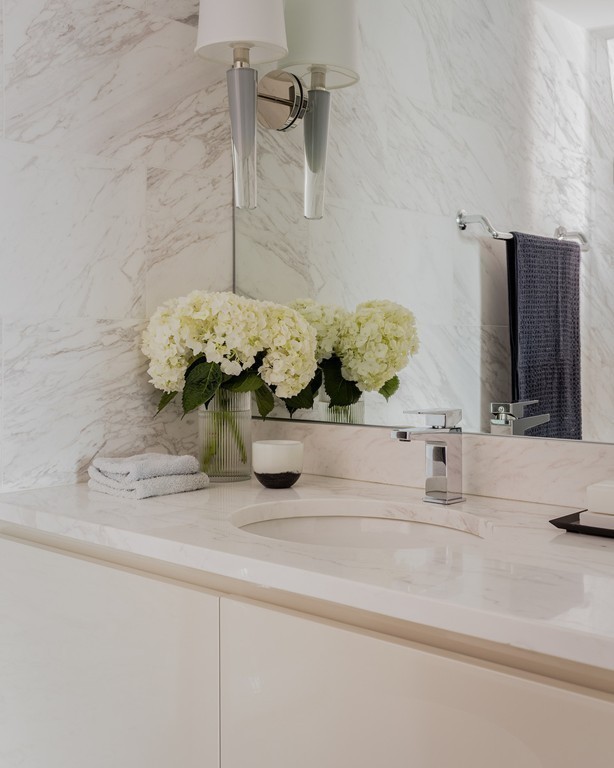 20 Rowes Wharf, Unit 610 Boston, MA 02110 - Photo 18 of 20 a bathroom with a sink a vanity and a mirror